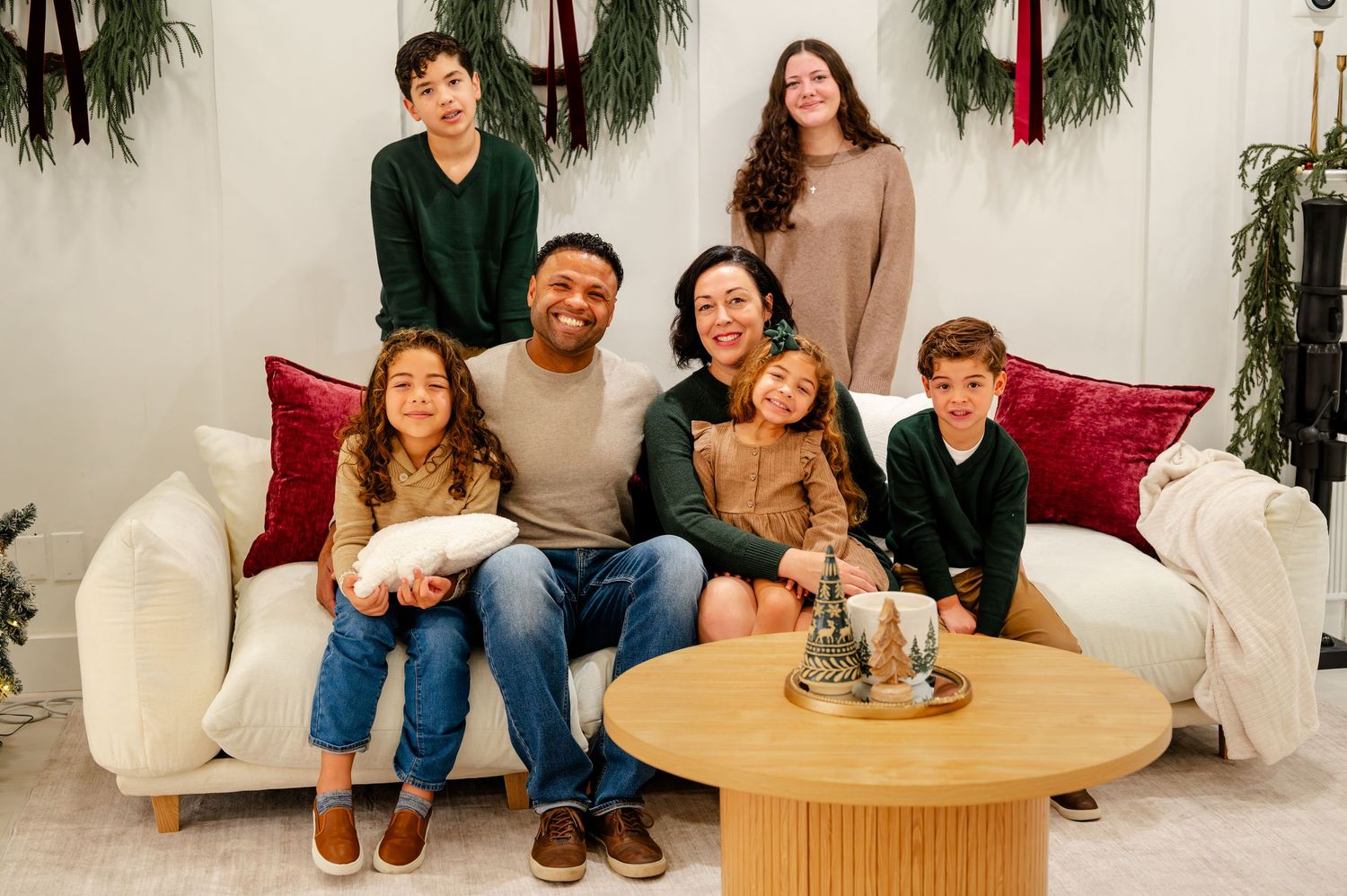 A collection of holiday family photos showing people relaxing on couches and around coffee tables with festive decor.