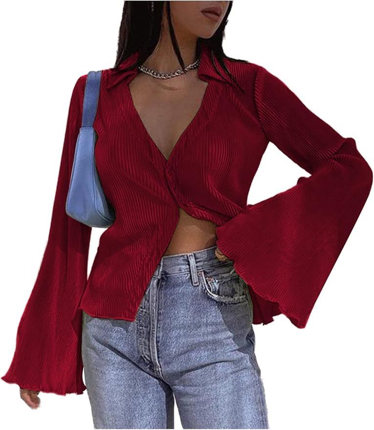 Deep red cropped wrap top with bell sleeves paired with light wash denim.