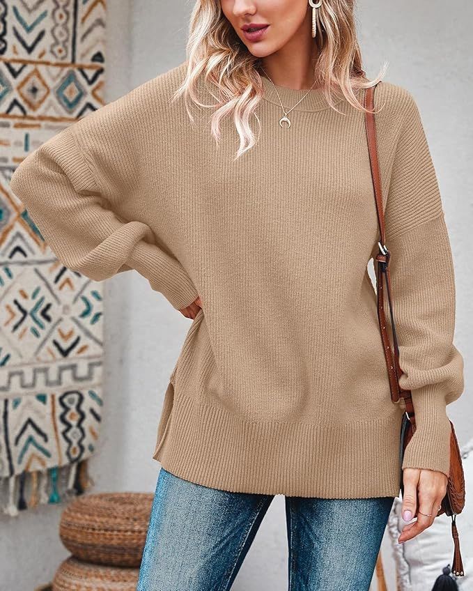 Oversized beige knit sweater with ribbed details and relaxed fit styling.