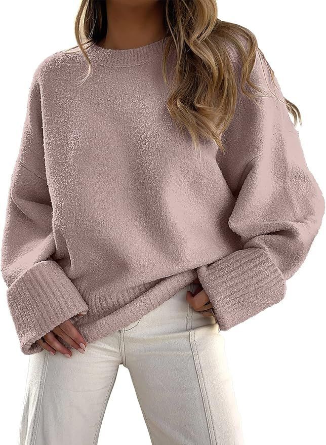 Oversized mauve knit sweater with ribbed cuffs and relaxed fit design.