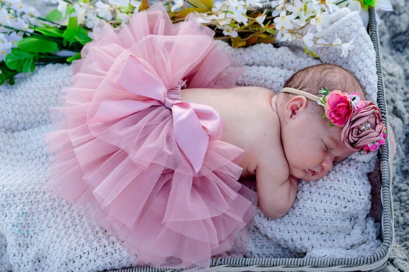 Baby girl on the Jacksonville beach as a newborn, newborn photography is Jessica Life Photographer's passion!