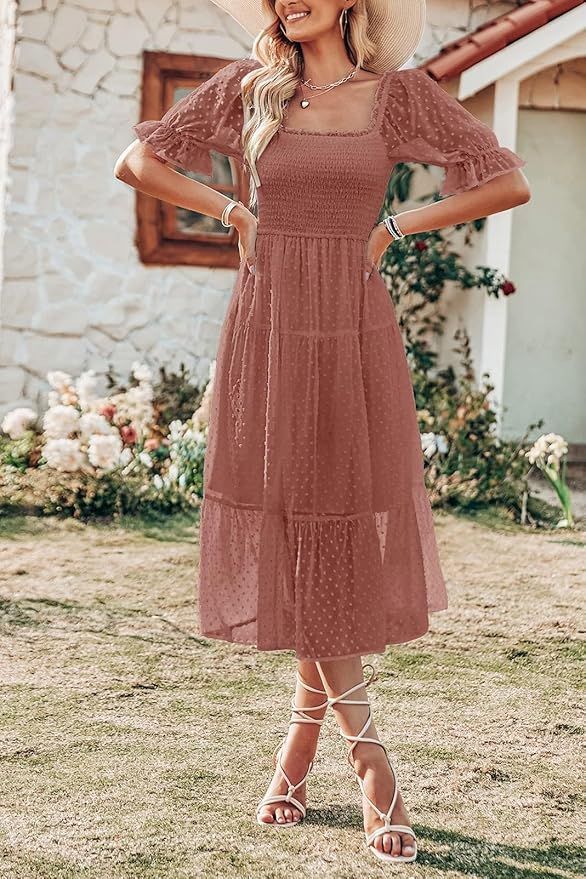 Dusty rose crochet dress with tiered skirt and sandals shown against stone wall.