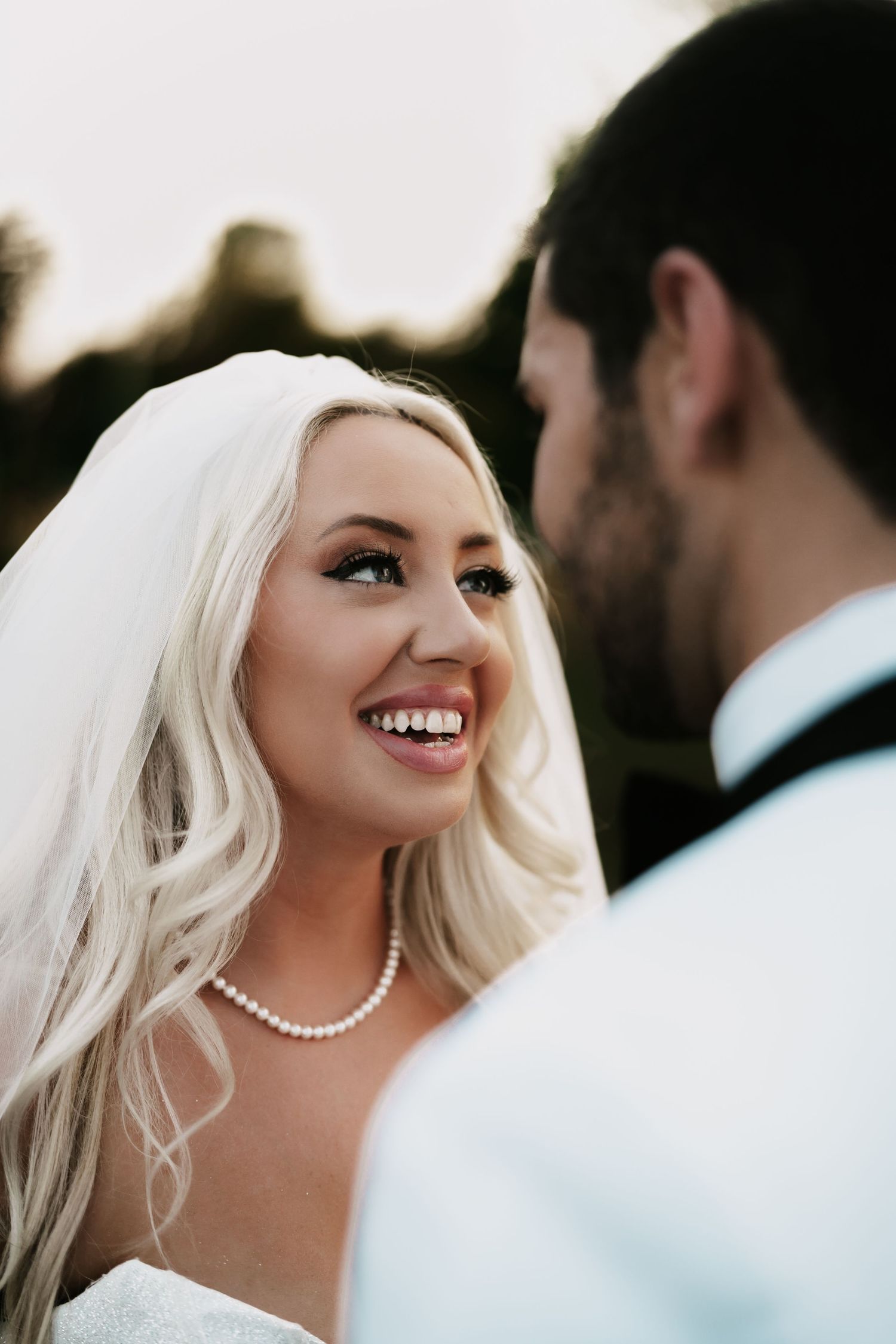 A romantic wedding portrait sequence showing tender moments between newlyweds during golden hour.
