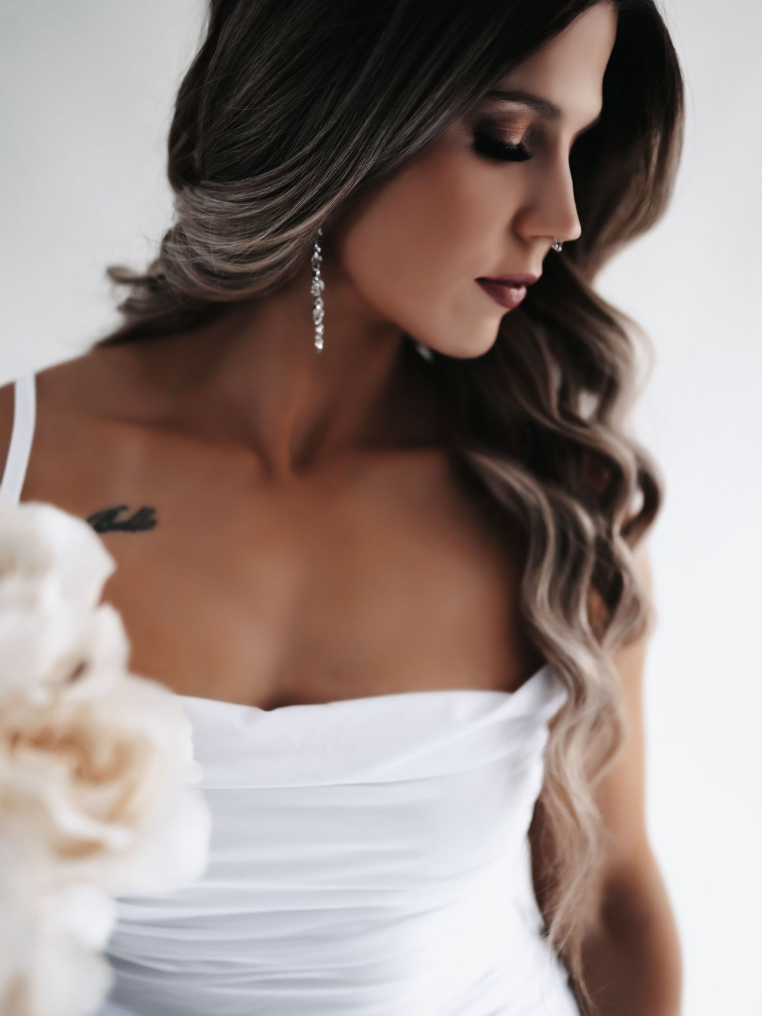 A glamorous bridal portrait series showing elegant white dress details and soft romantic styling in profile views.
Belle Meade Events