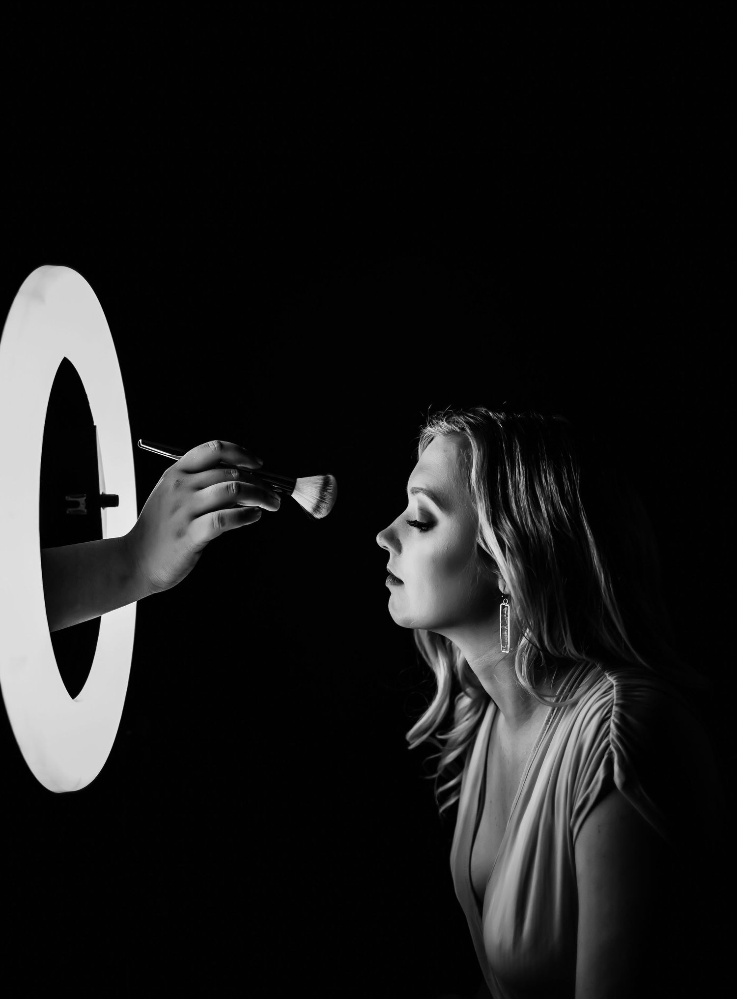 A dramatic black and white photo series showing a person's profile against dark backgrounds in artistic poses.
Brown Hotel