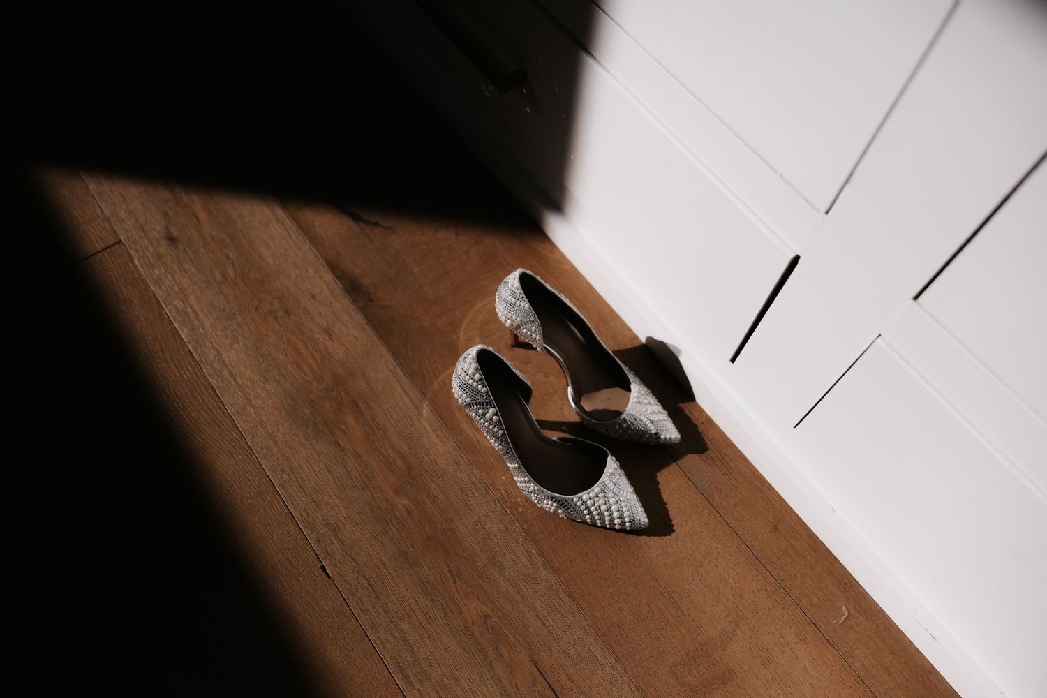 A sequence of photos showing feet walking across a wooden floor in black and white sneakers.
Cheekwood