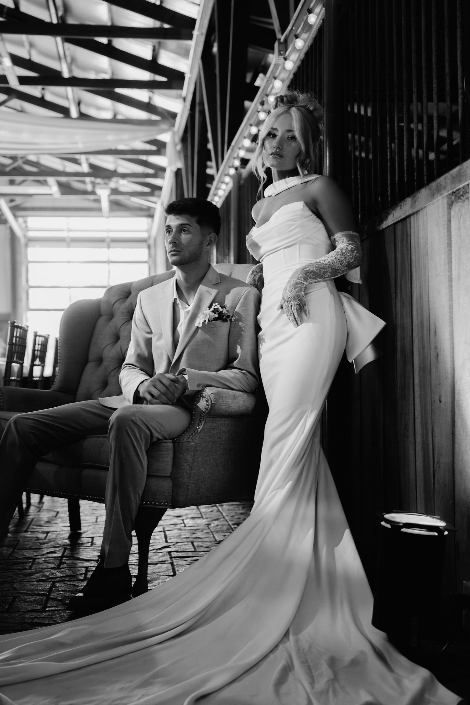 A black and white photo series showing a couple in formal wedding attire posing intimately in an elegant interior setting.
