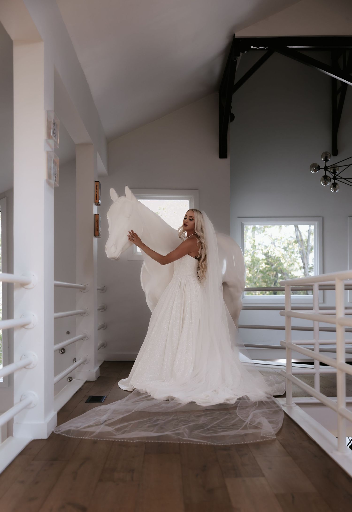 A flowing white wedding dress twirls gracefully in a series of six connected photos showing movement across a hardwood floor.