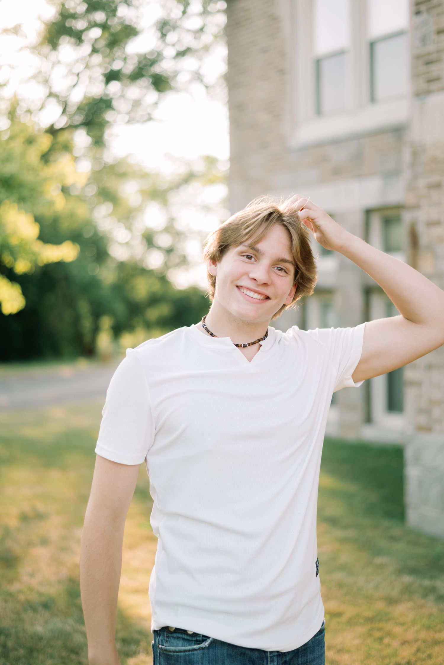 Blonde boy smiling at camera