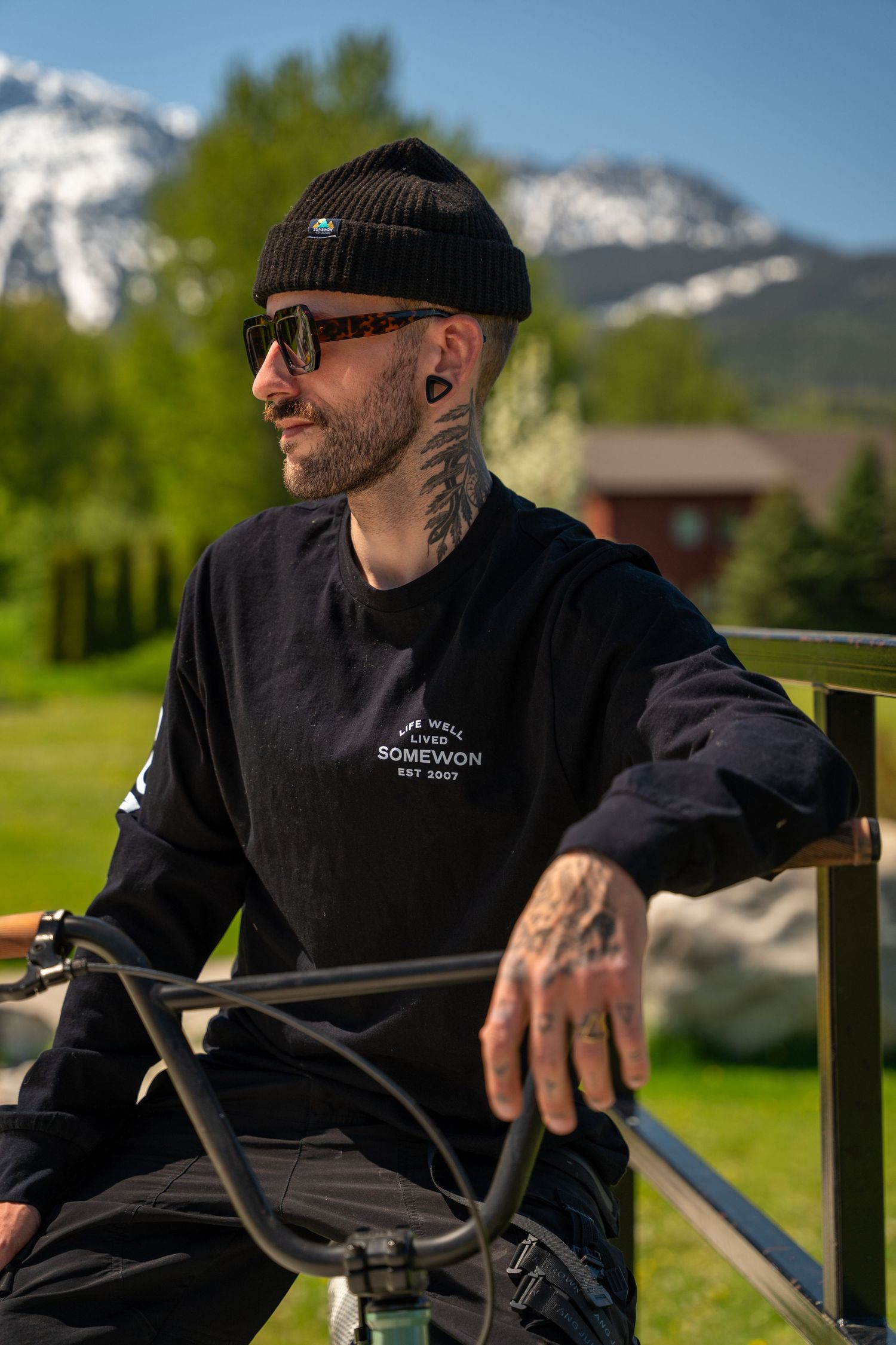 Outdoor portrait of artist in natural light with mountains in background