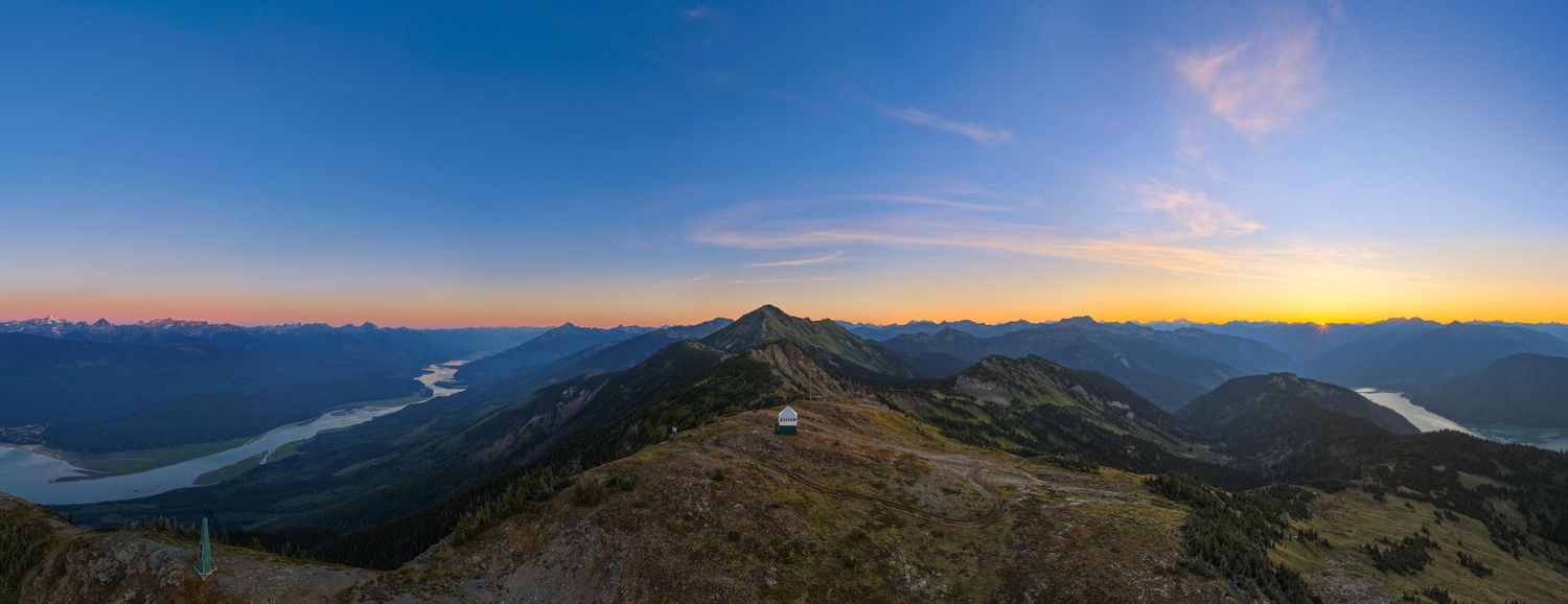 Sunrise drone footage over alpine ridgeline in Western Canada for tourism marketing Revelstoke videography services, professional video prod