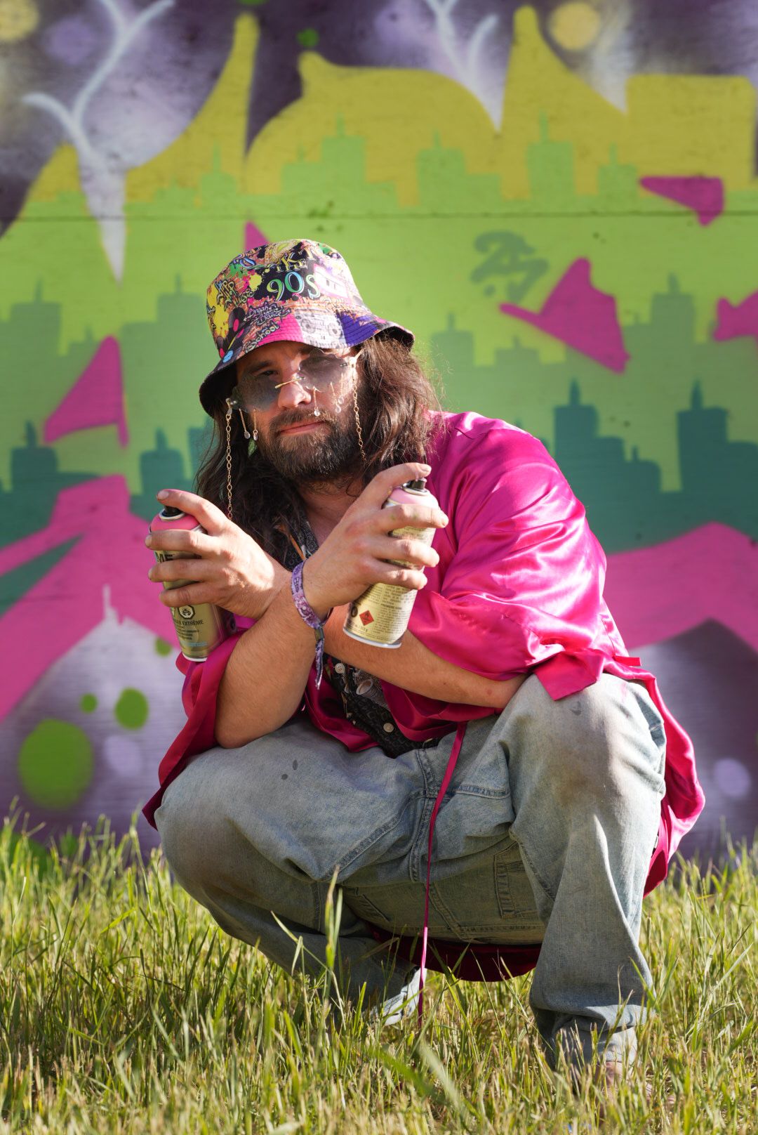 Grafitti artist portrait artist performing live at Deep Roots Music Festival 2025 event candid shots, crowd and performer photography, Revel