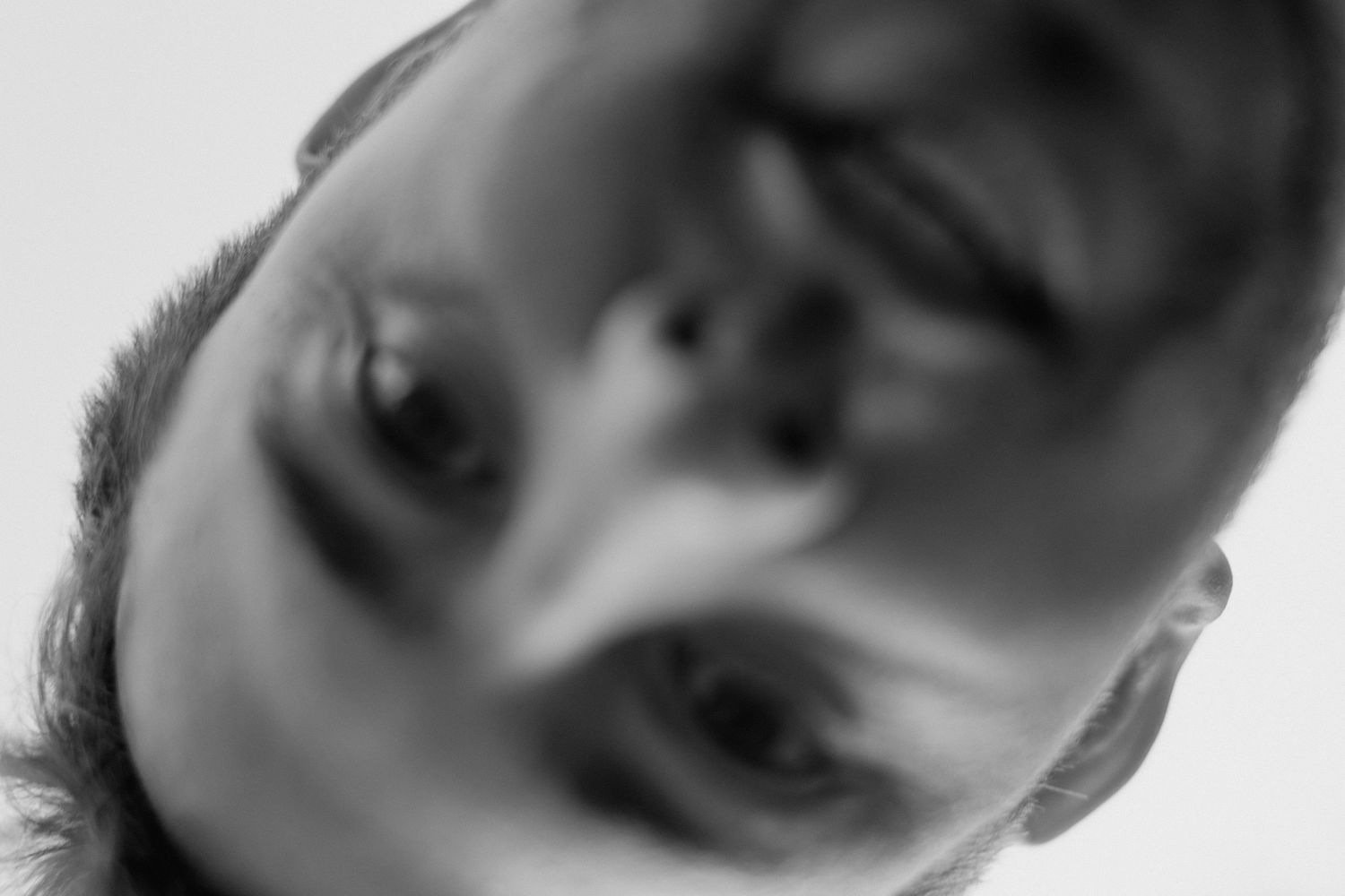 Artistic black and white portrait shot in soft focus.