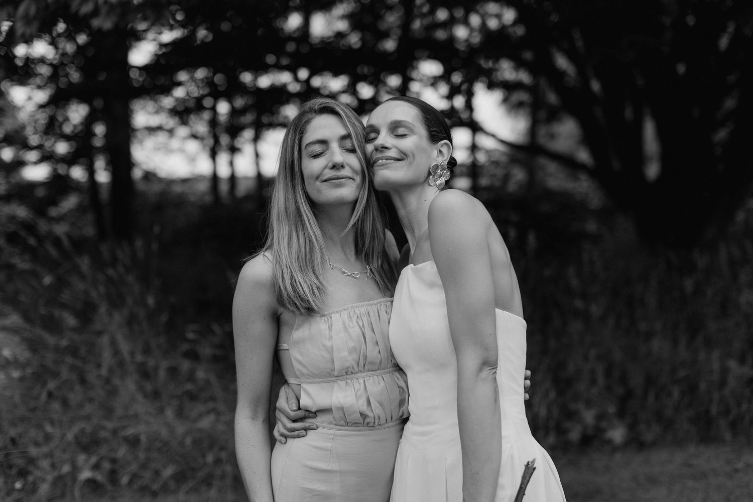 A series of candid black and white photos showing friends laughing and embracing.