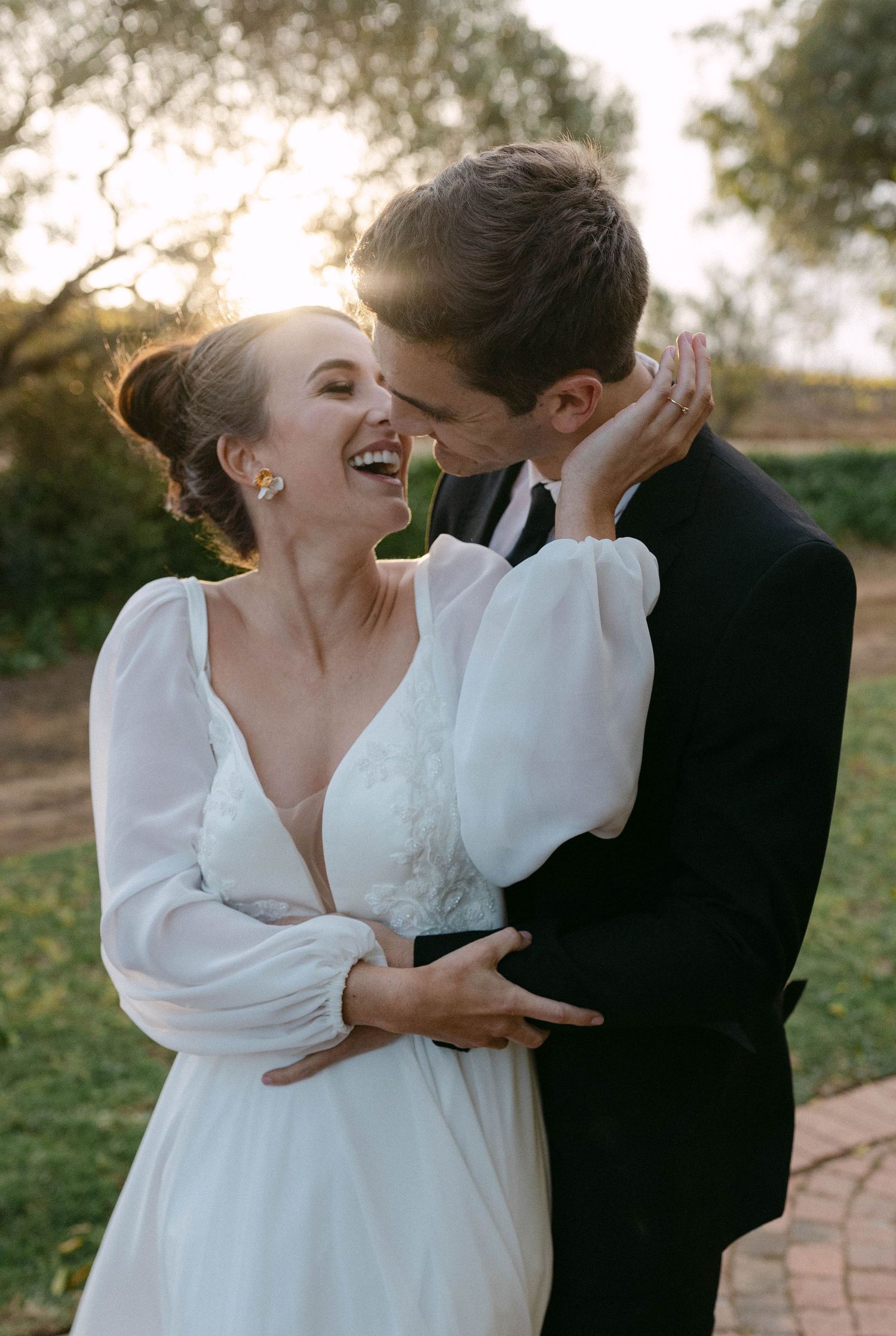 Romantic wedding moment captured in sequence with white dress and black suit.