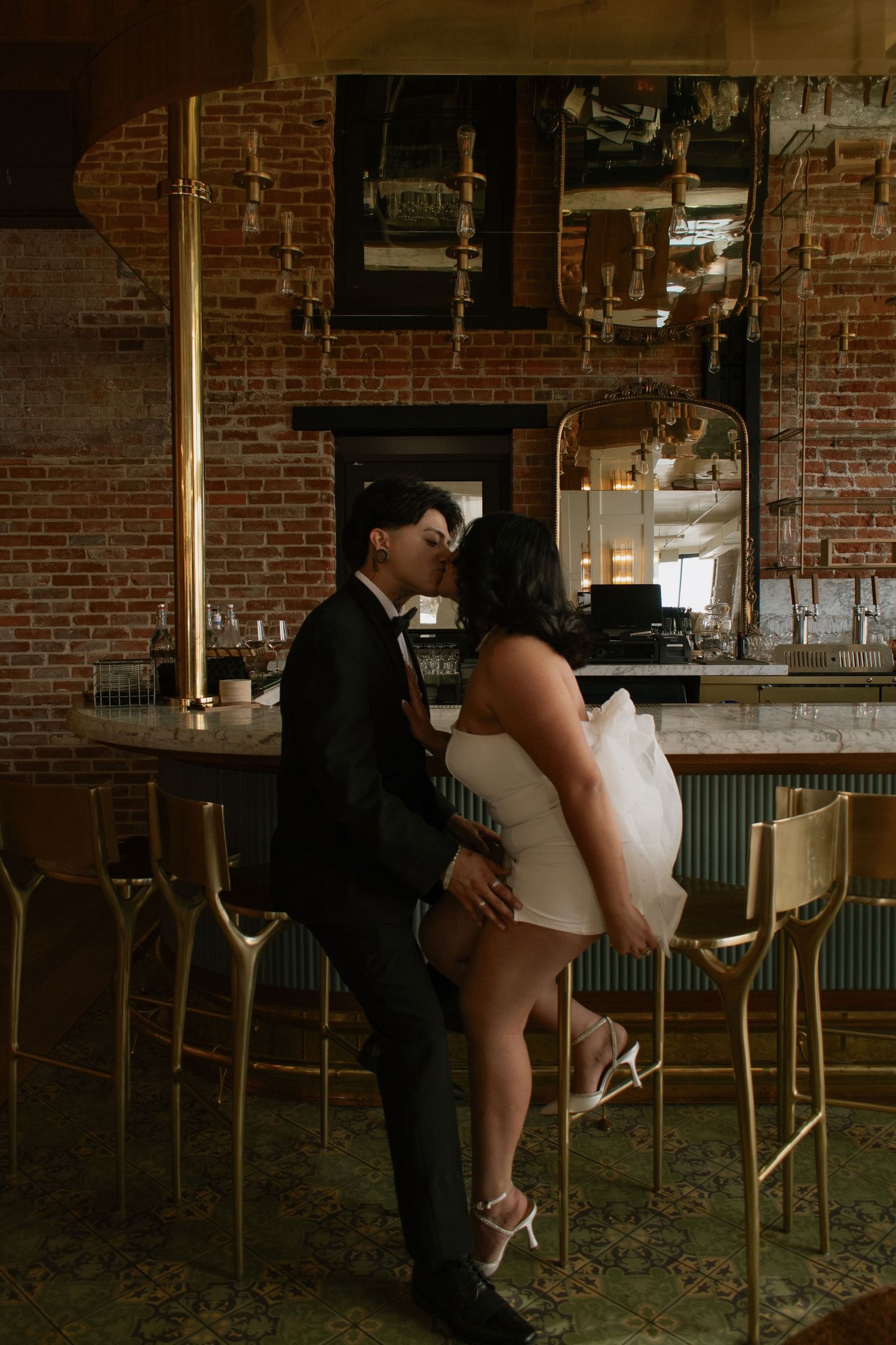 couple at a hotel bar kissing engagement editorial modern proposal wedding elopement