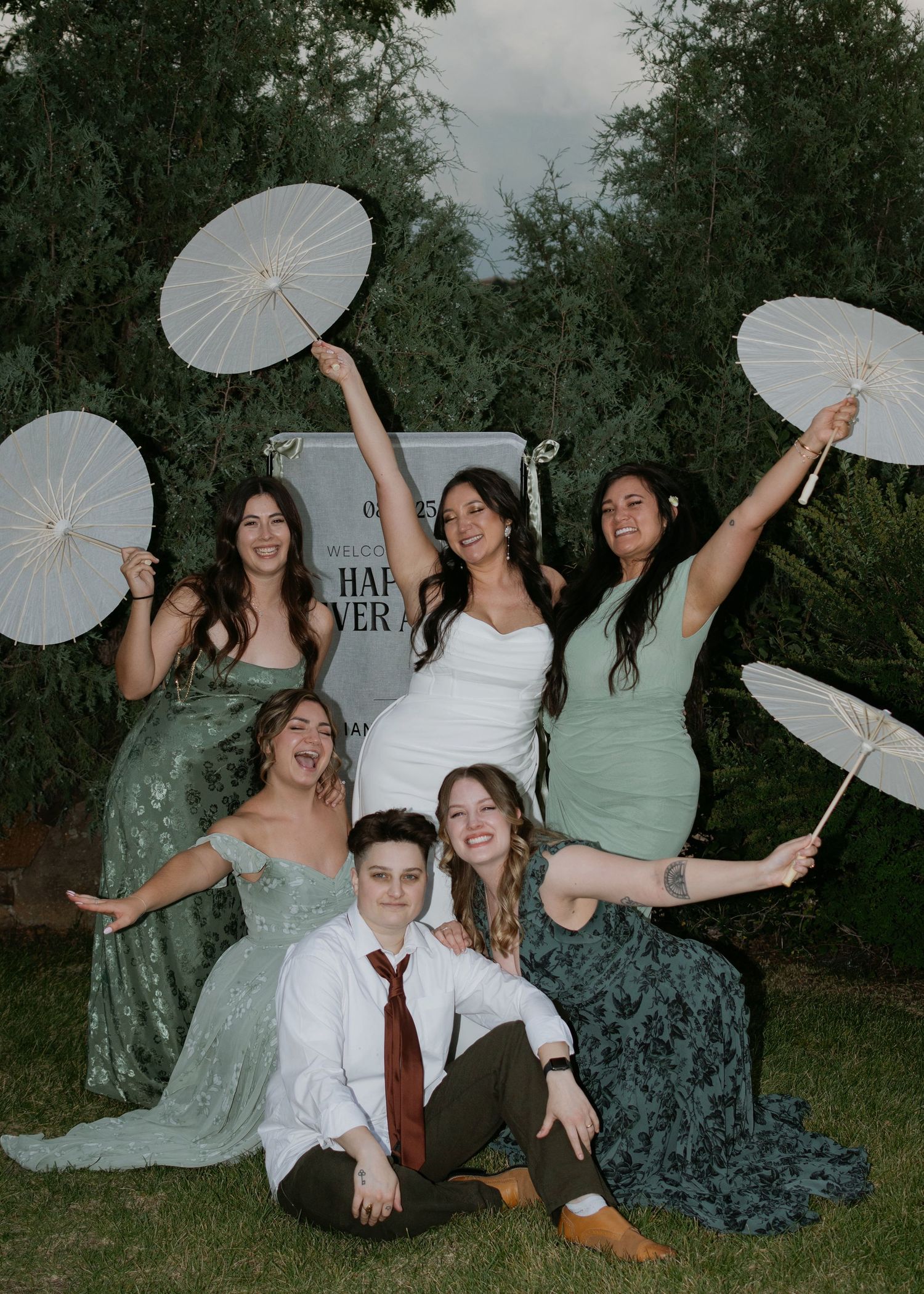 garden wedding bridesmaids smiling with parasols, green satin dresses, flash editorial