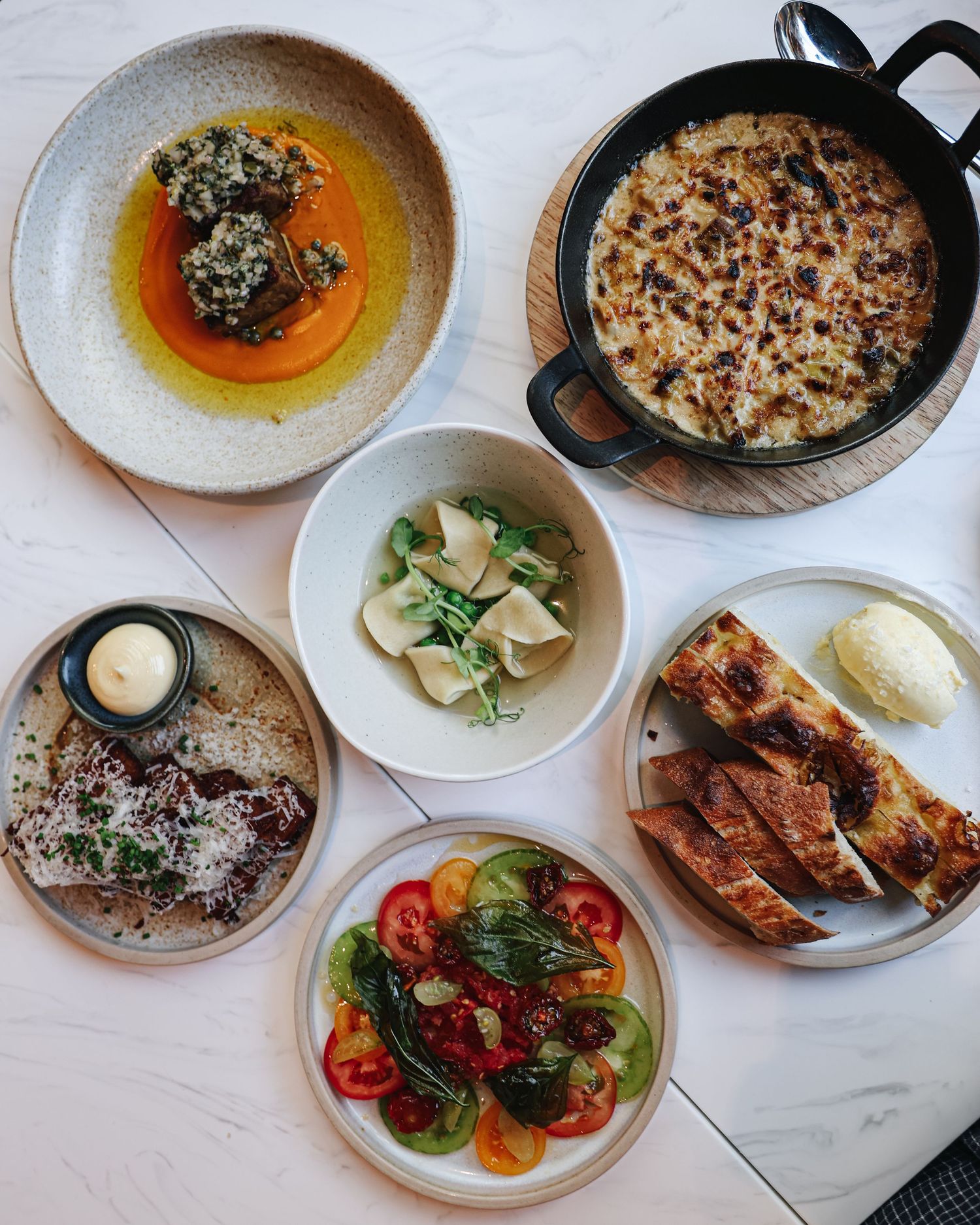 A flatlay photo of various dishes in a restaurant