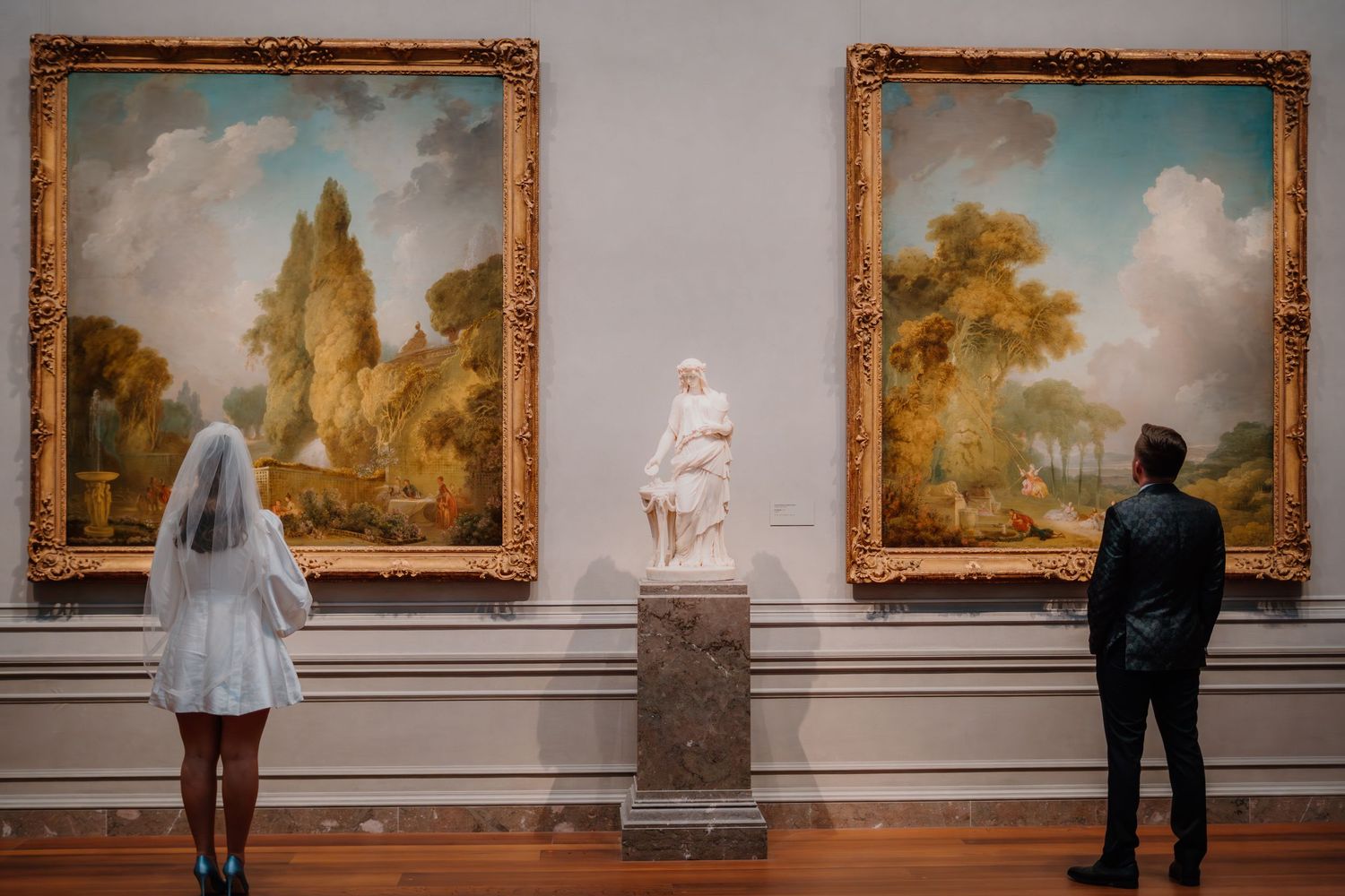 Bride and groom looking at portrait at the National Gallery of Art in Washington DC
