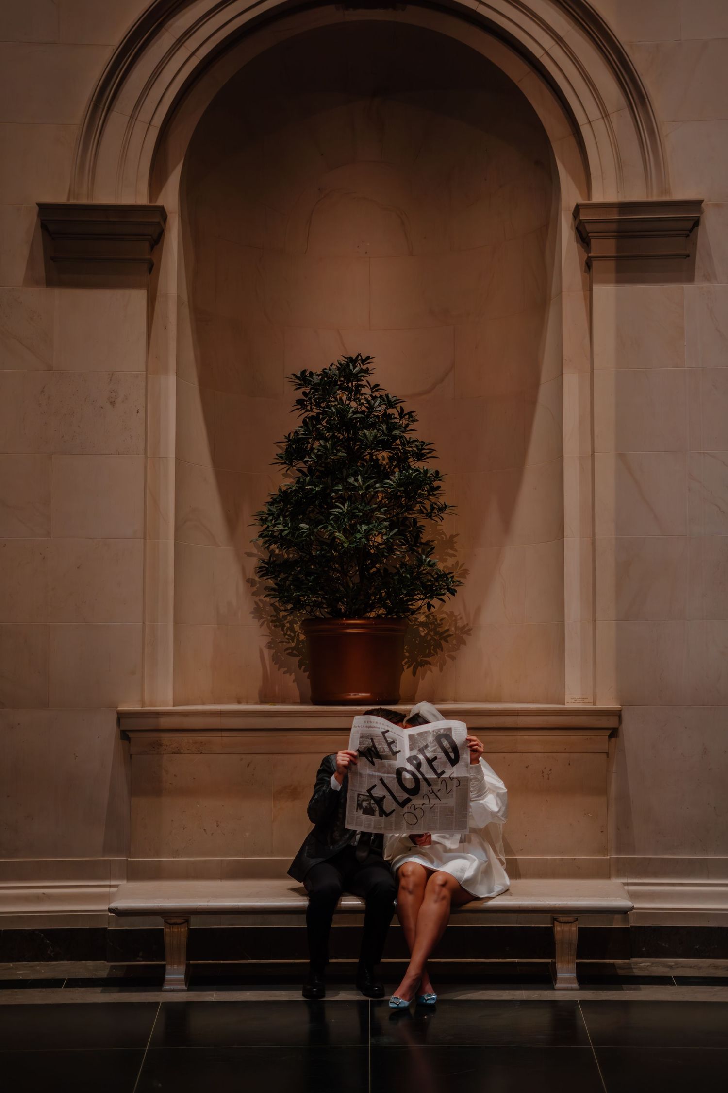 Bride and groom holding a 