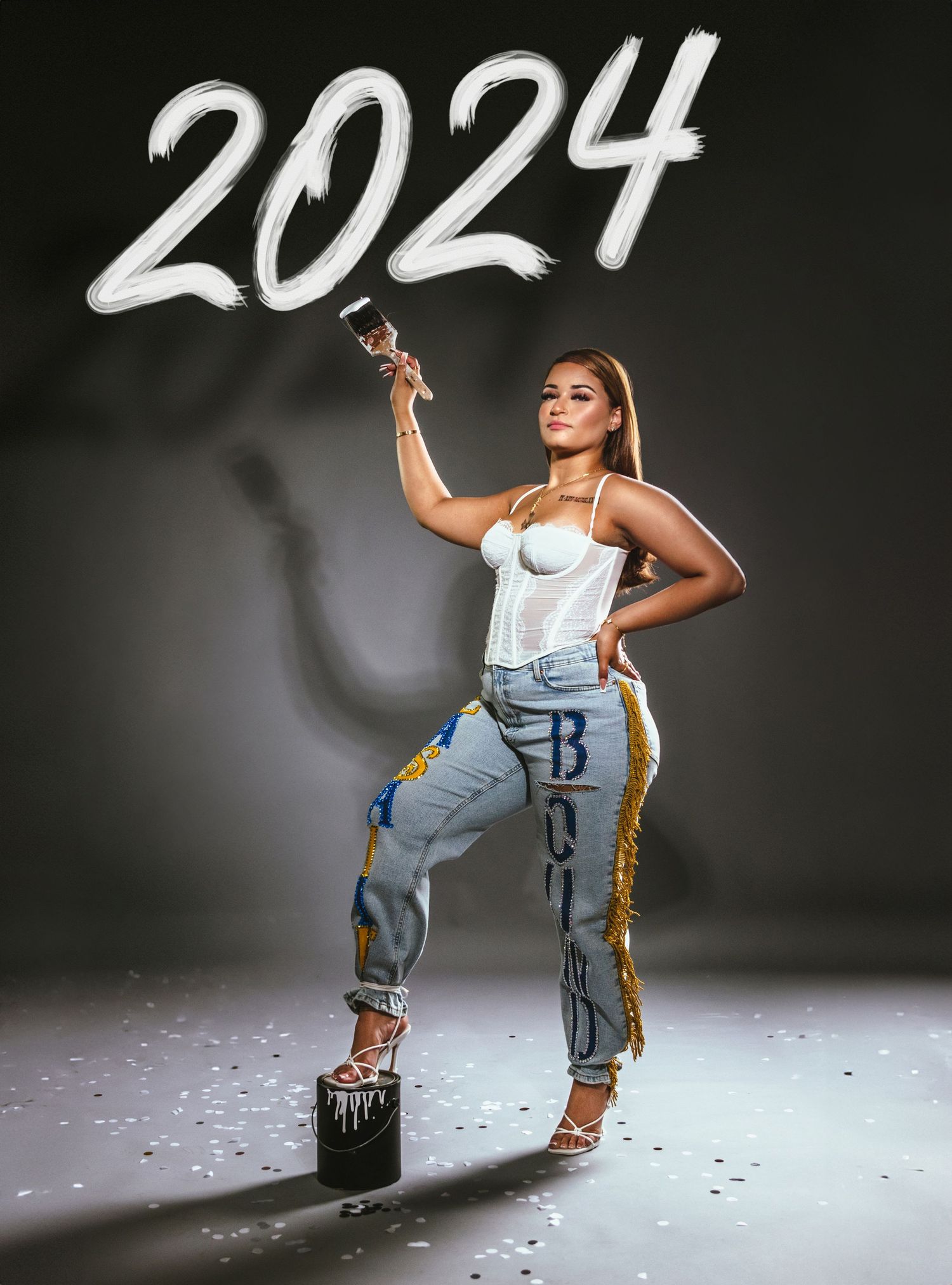 Creative 2024 themed portrait with model in casual streetwear against dark background.