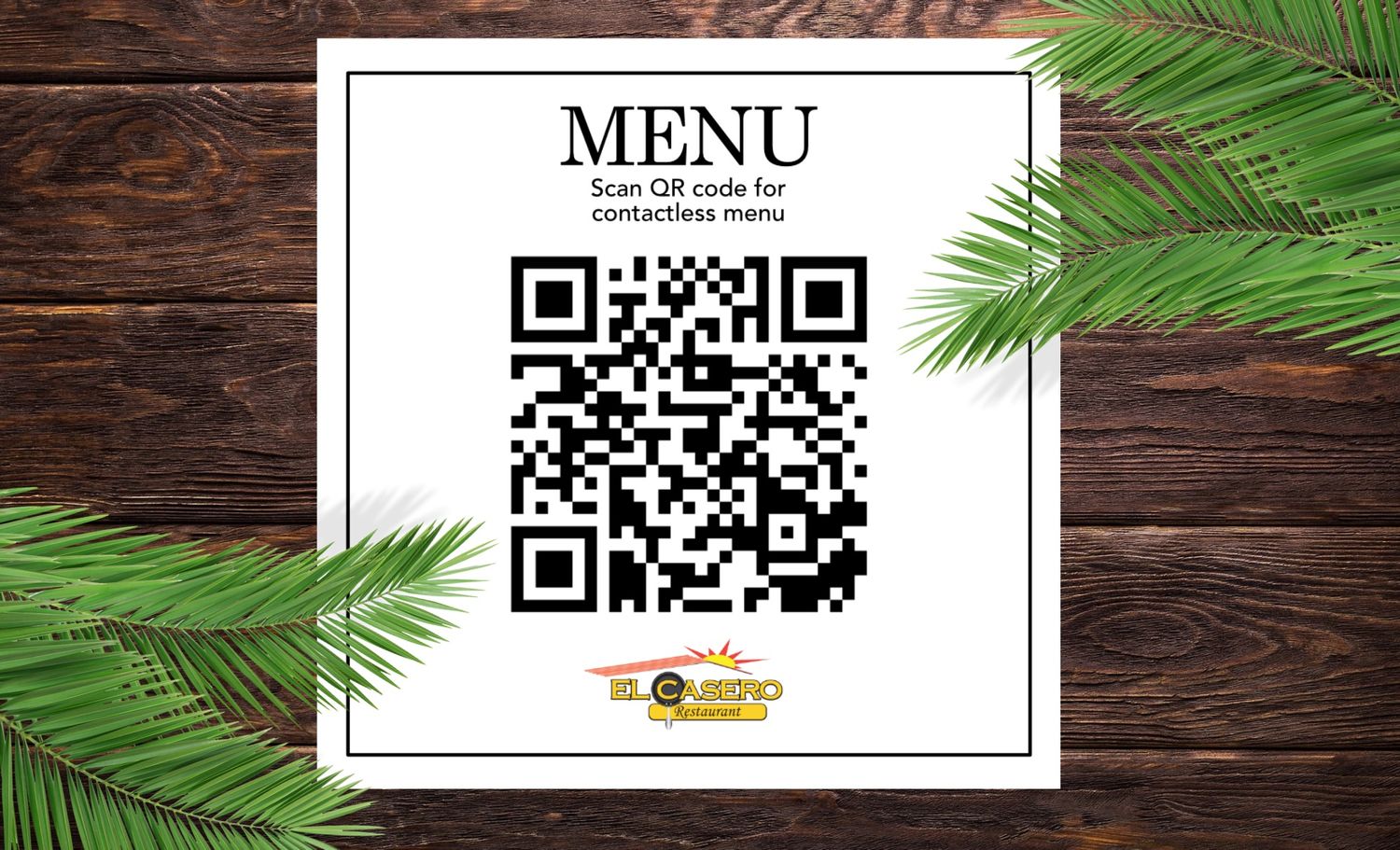 Restaurant menu QR code display card with palm leaves on wooden background.