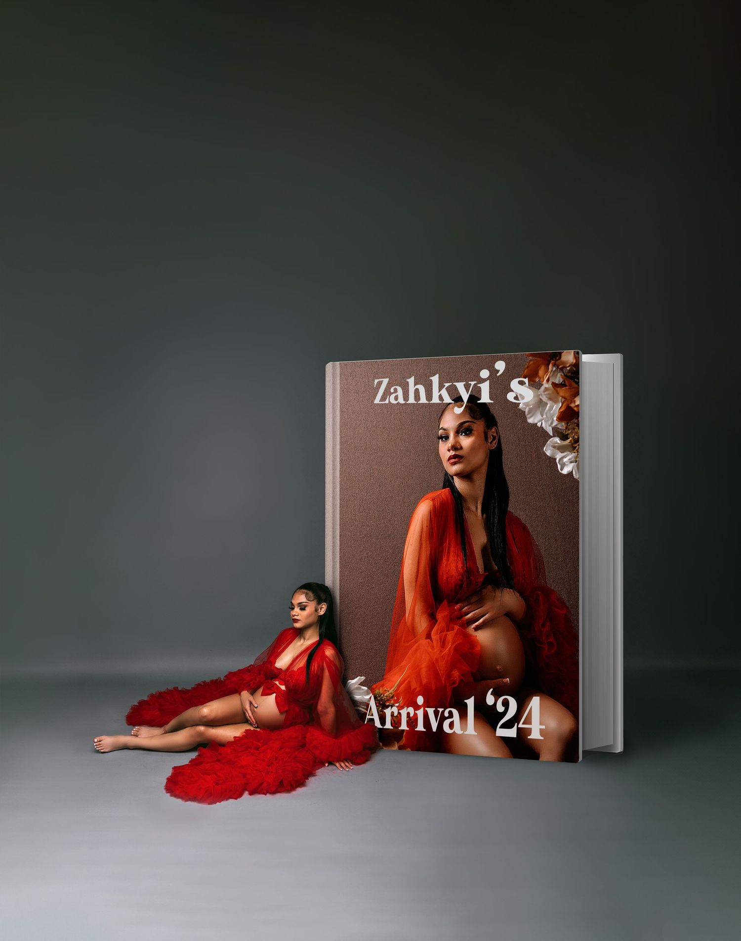Creative book cover design featuring maternity portraits in red dress with floral accents.