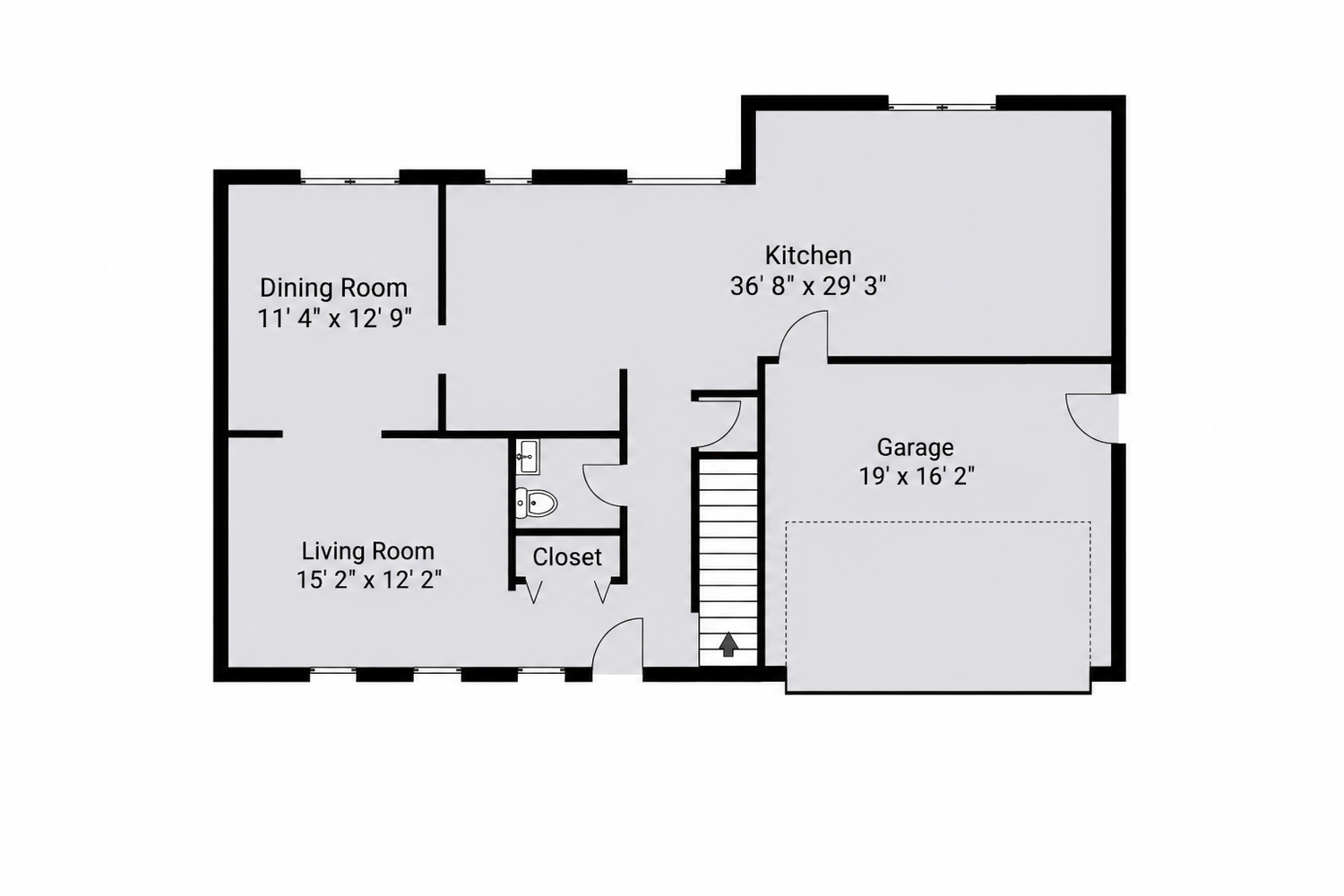 Floor plan showing dining room, living room, kitchen, garage, closet, and staircase layout of a single-story home.
