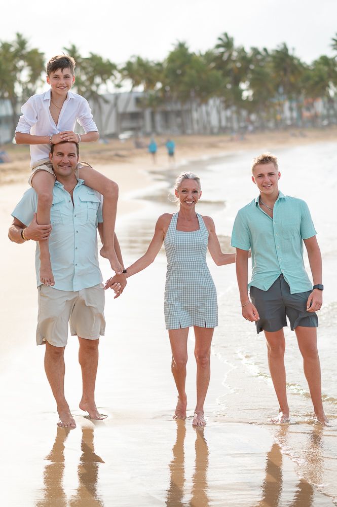 Group photo of family walking together on Playa Azul beach in Luquillo Puerto Rico