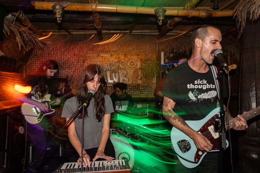 punk band rocking out in tiki bar Long Beach California