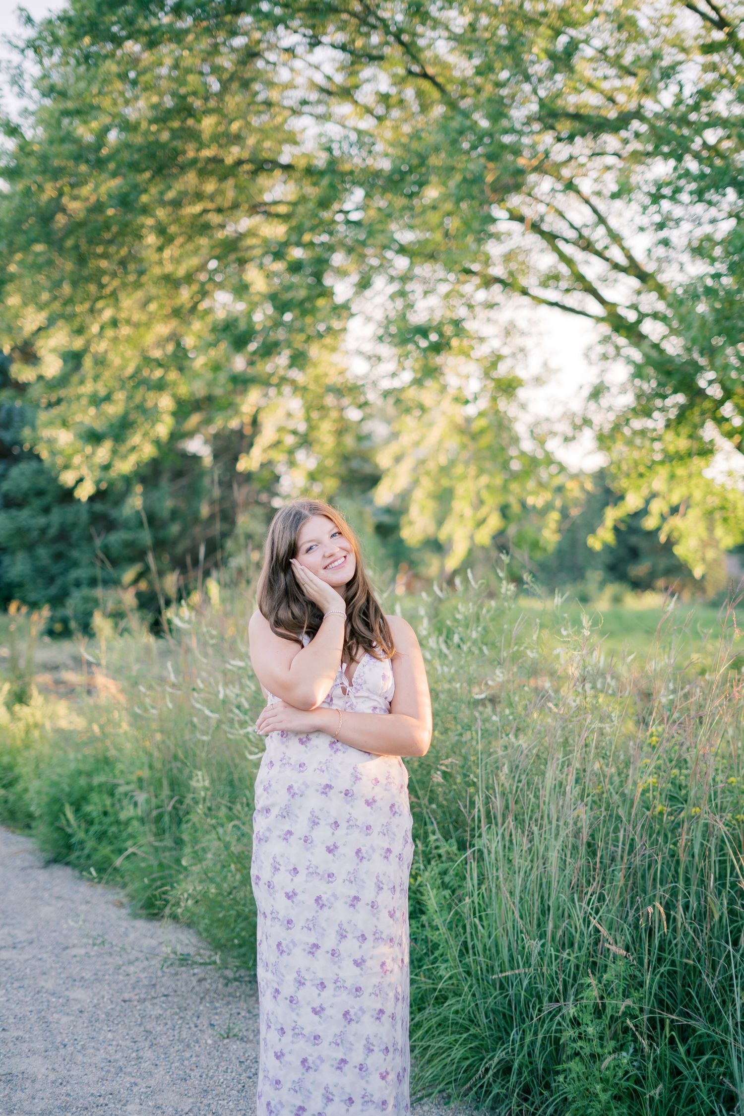 A sequence of joyful poses in a summer field with tall grass and sunlit trees in the background.