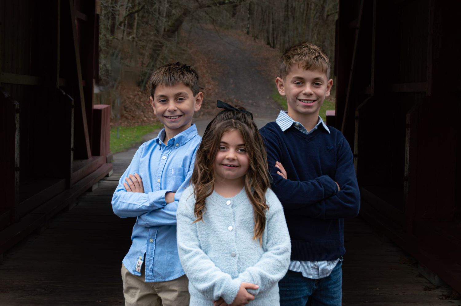 A series of casual outdoor portrait photos arranged in a horizontal strip showing people in blue and white clothing.