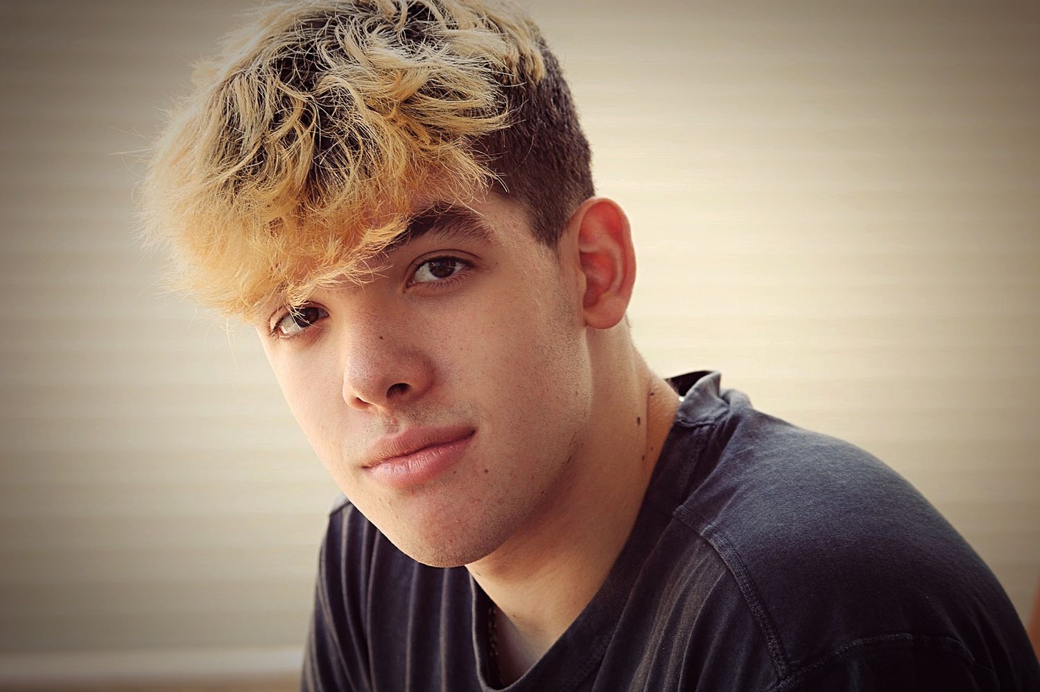 A series of portrait photos showing a person with blonde hair in different poses and expressions.