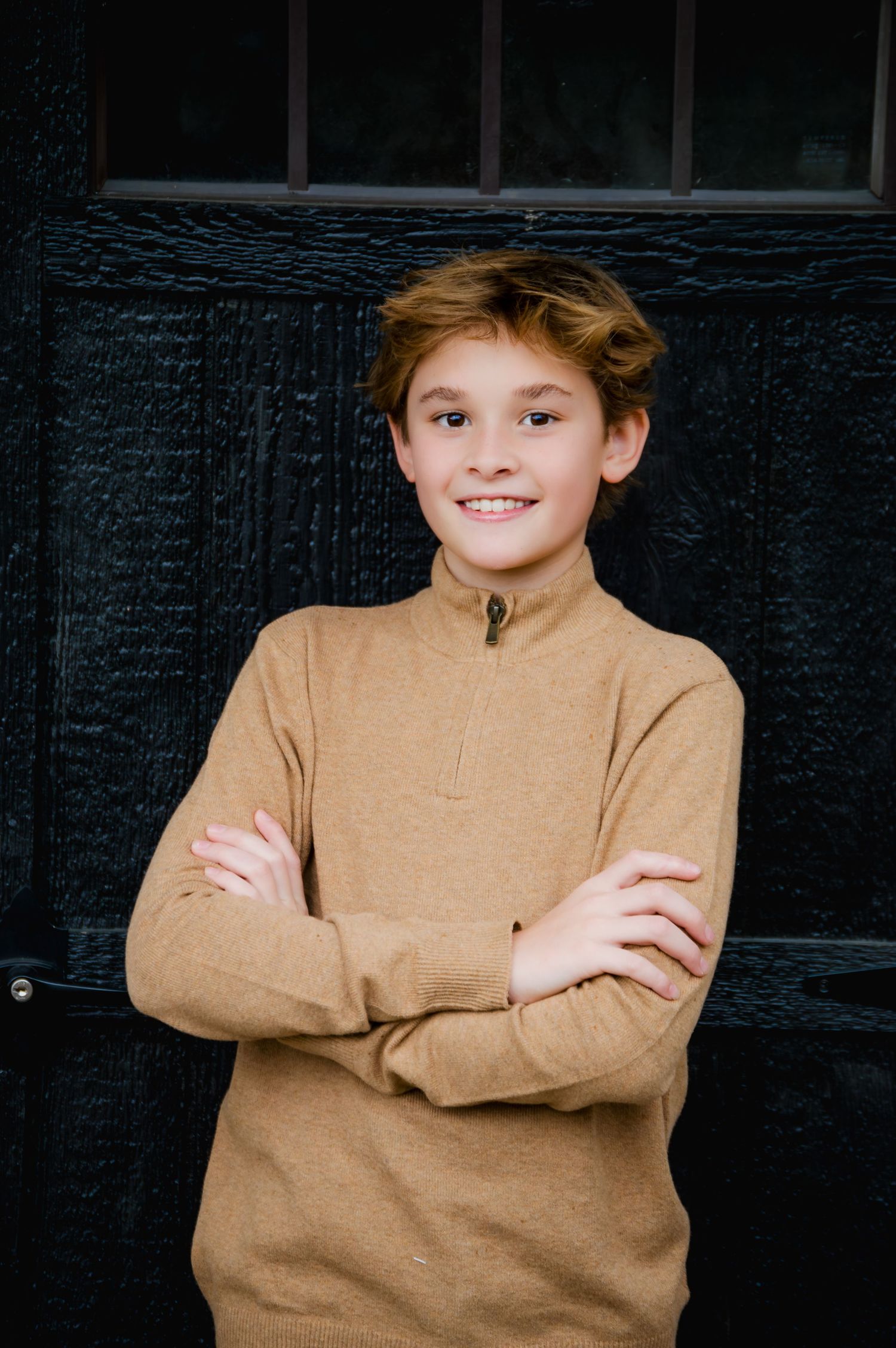 A series of four similar photos showing someone in a tan sweater against a dark background with crossed arms.