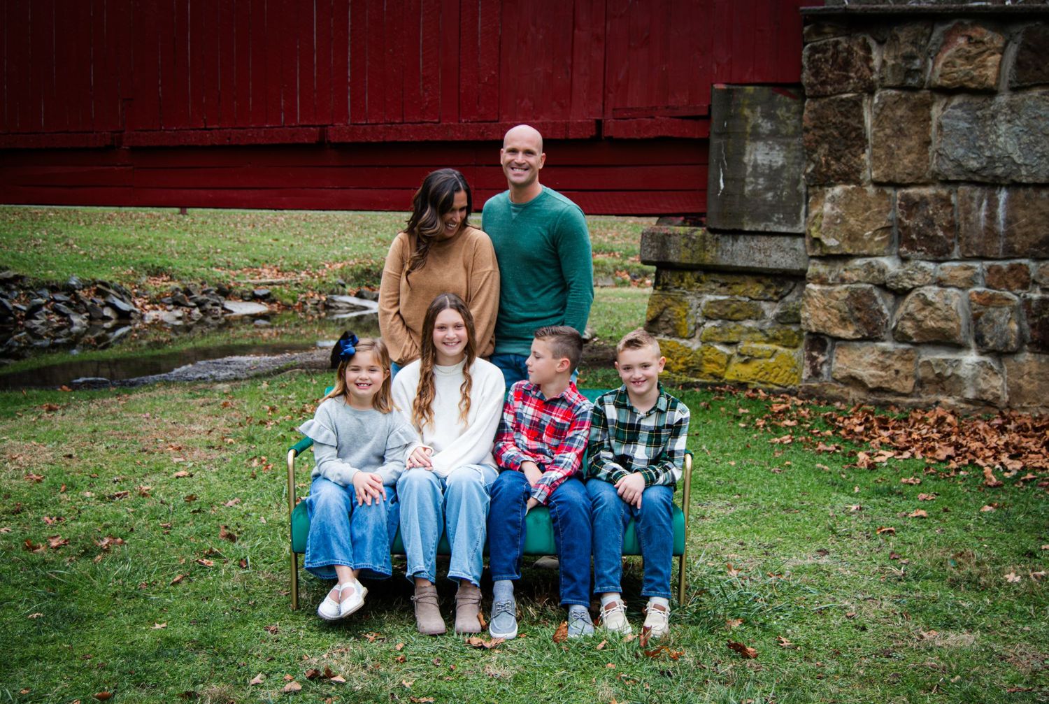 A series of outdoor family portraits showing people sitting together on grass and steps in casual clothing.