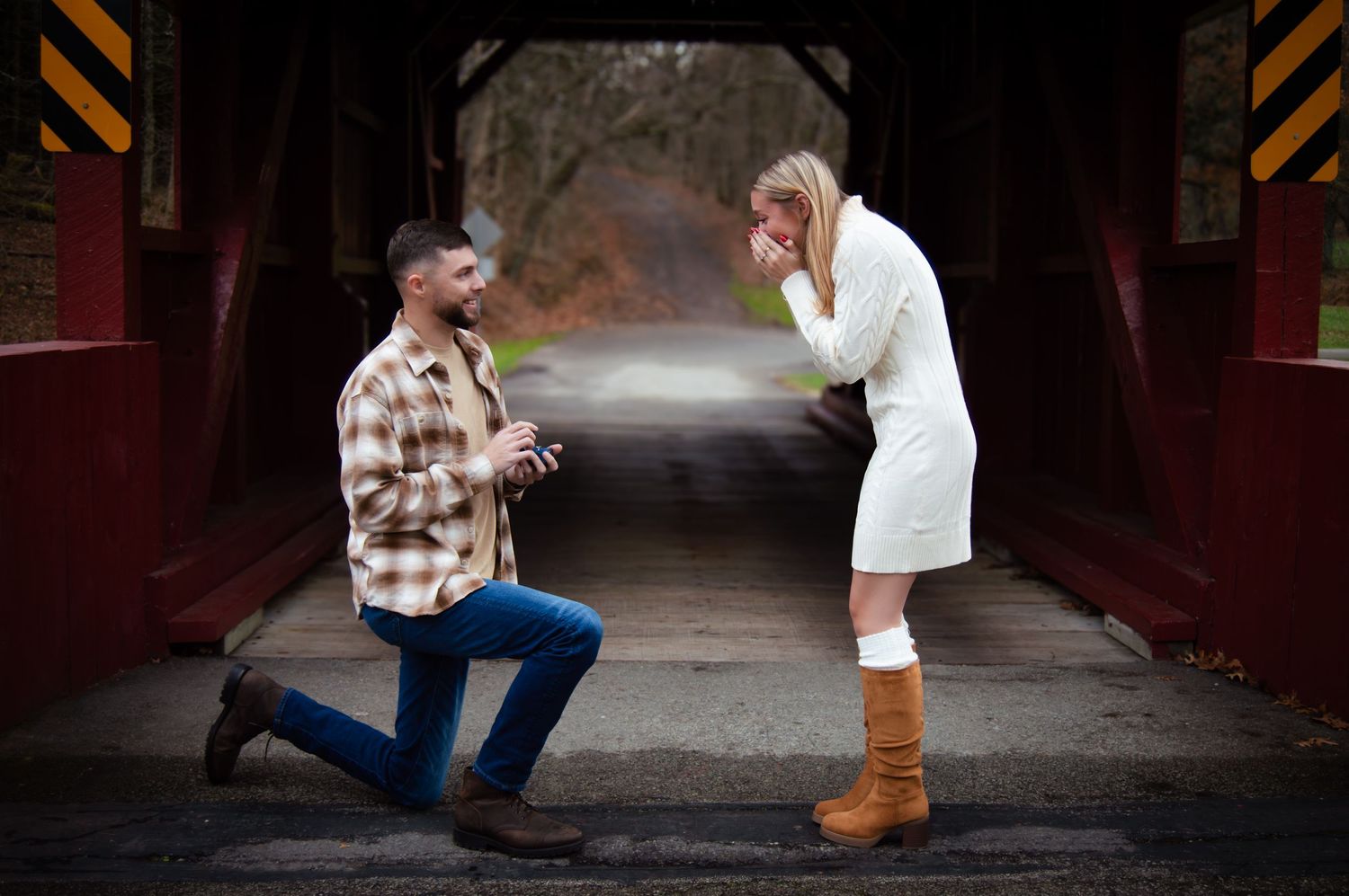 A series of romantic proposal photos on a covered bridge showing a couple getting engaged at sunset.