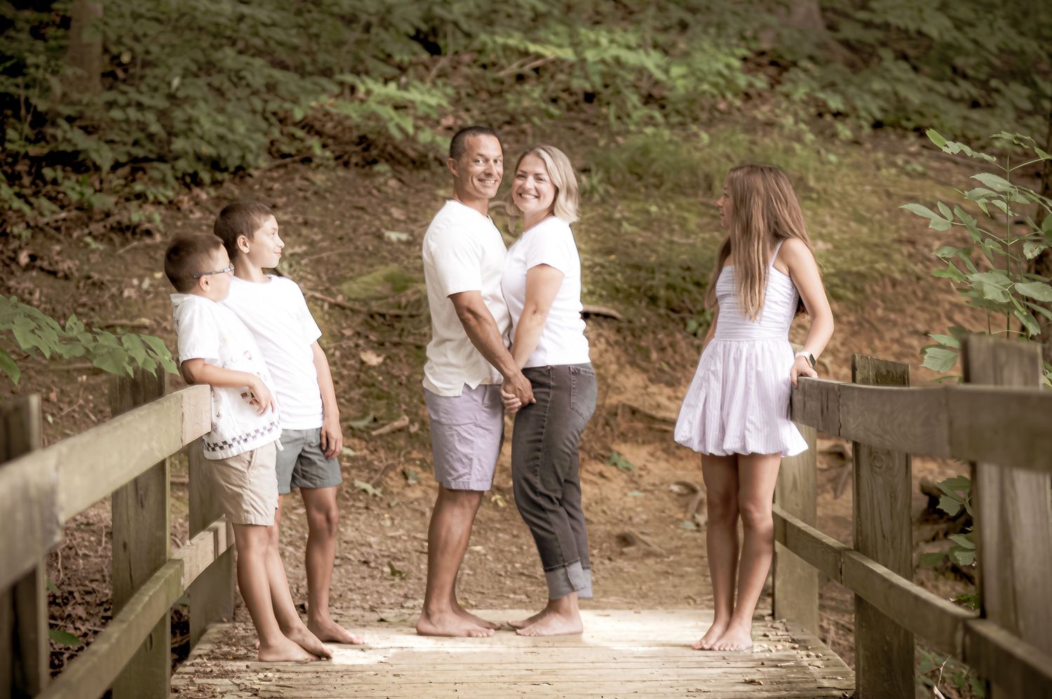 A series of candid moments captured in a rustic outdoor setting with people in casual white and gray attire.