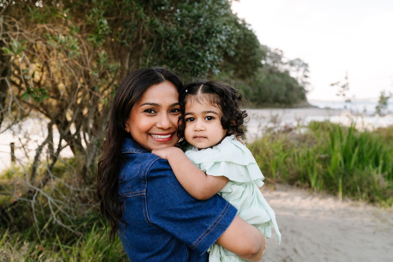 Heartfelt family connection at a North Shore sunset beach. Timeless, documentary-style photography by Little Wild Ones