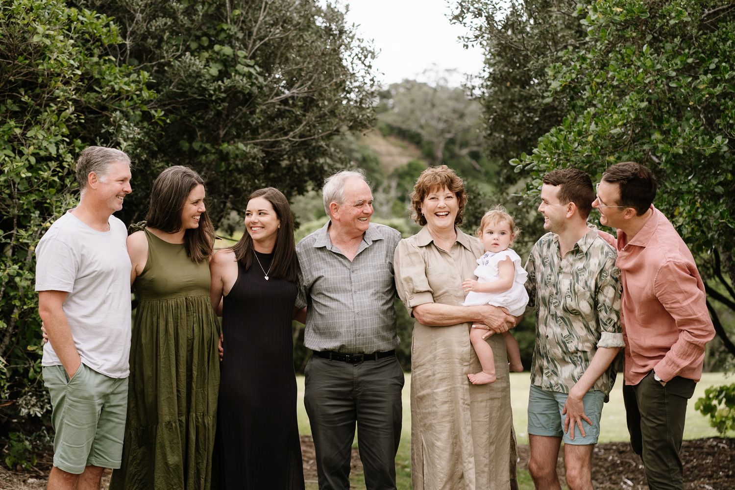 Family portrait session featuring parents and their older children sharing laughter and connection. A mix of posed and candid shots