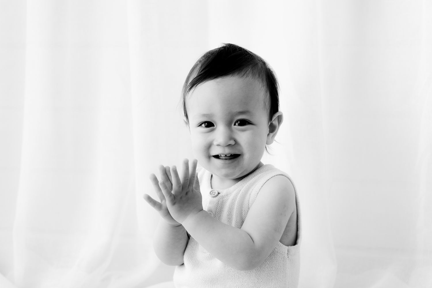 cute baby smiling in studio portrait