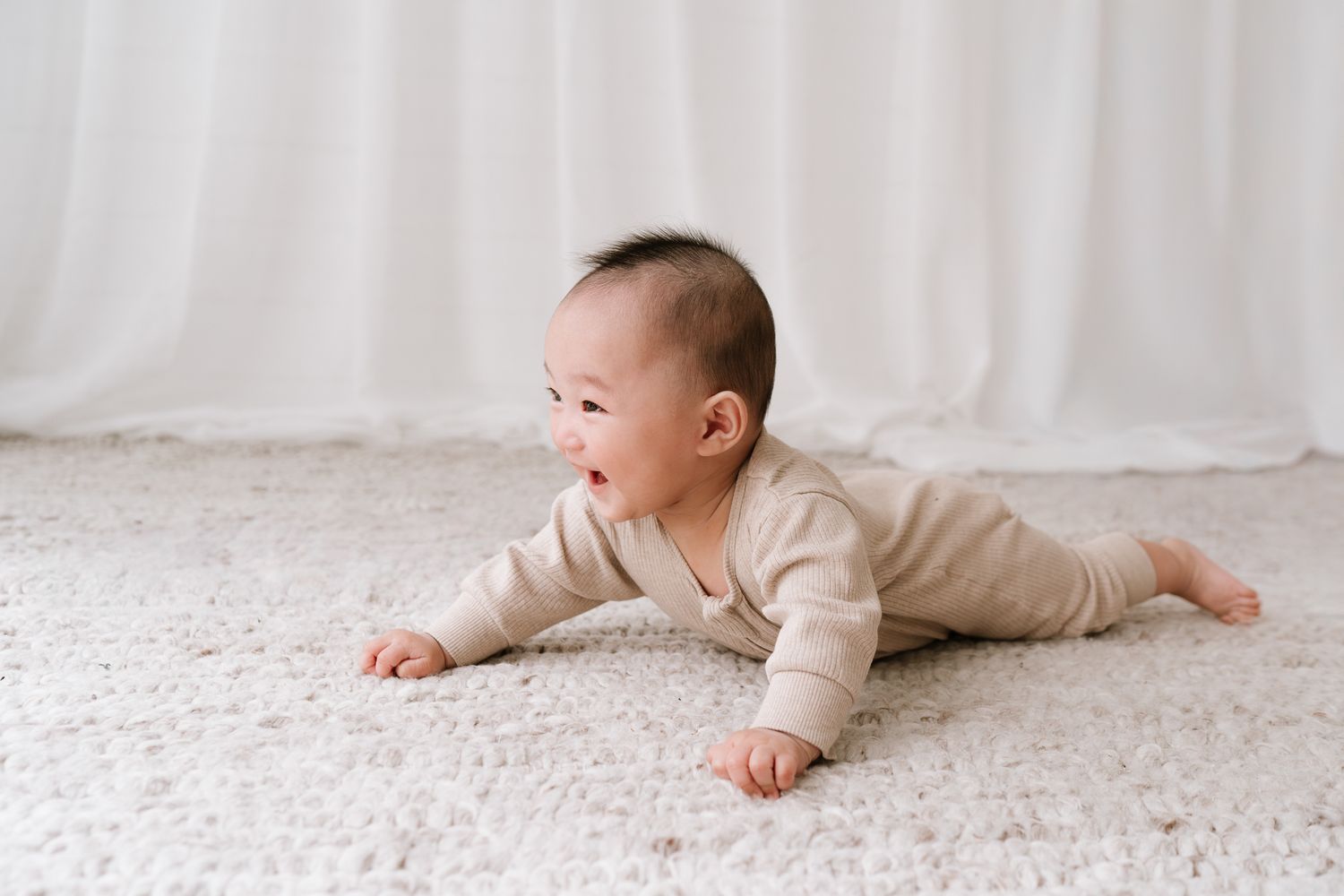 cute baby smiling in studio portrait