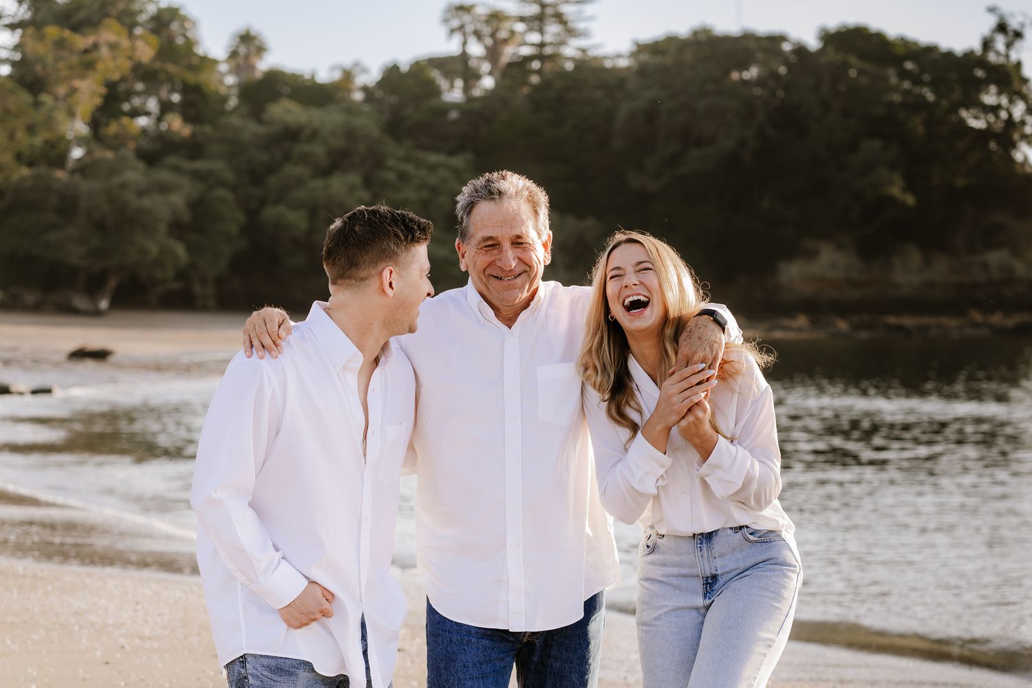 Family portrait session featuring parents and their older children sharing laughter and connection. A mix of posed and candid shots in a nat