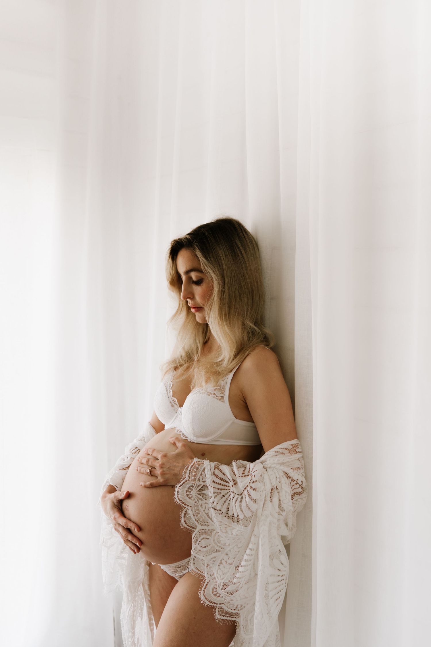 Studio maternity photography featuring our curated client wardrobe. A modern and minimalist session by Little Wild Ones, Torbay.