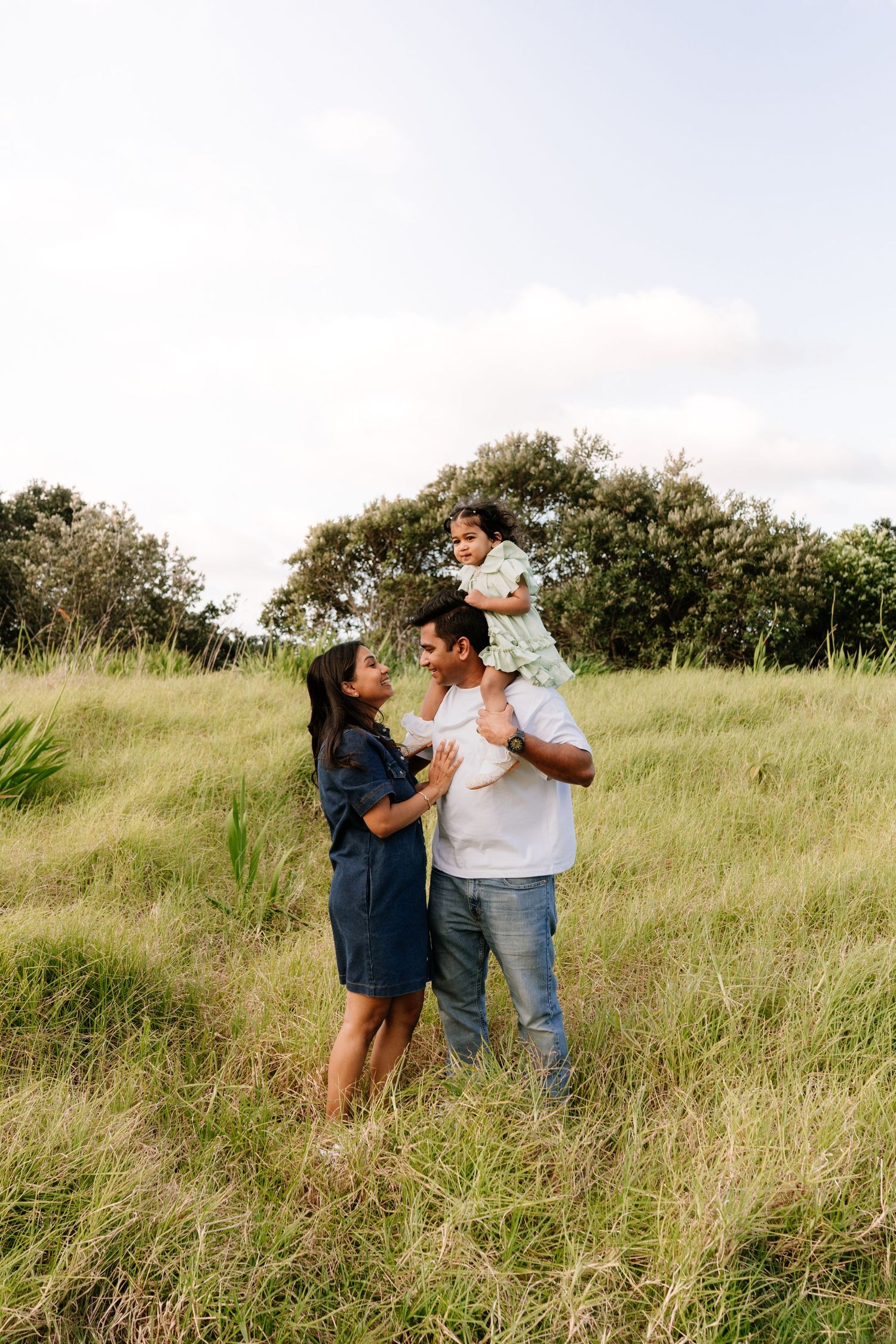 Heartfelt family connection at a North Shore sunset beach. Timeless, documentary-style photography by Little Wild Ones