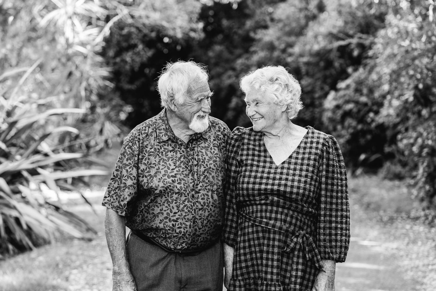 Family portrait session featuring grandparents looking at each other