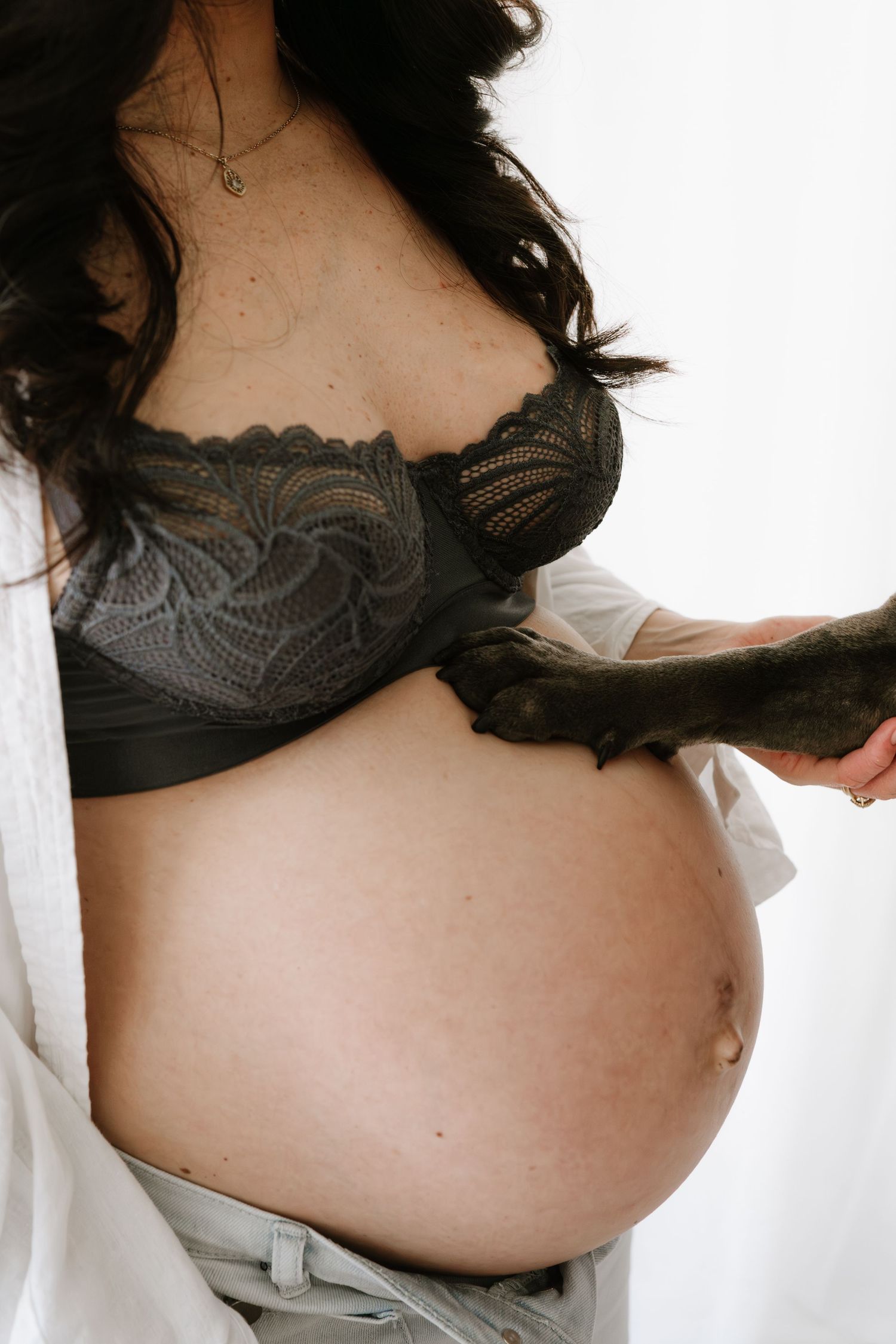 Modern family maternity session including the dog. Little Wild Ones captures honest emotion in our minimalist Torbay studio