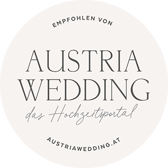 Circular grey badge logo for Austria Wedding wedding portal website with elegant typography and minimal design.