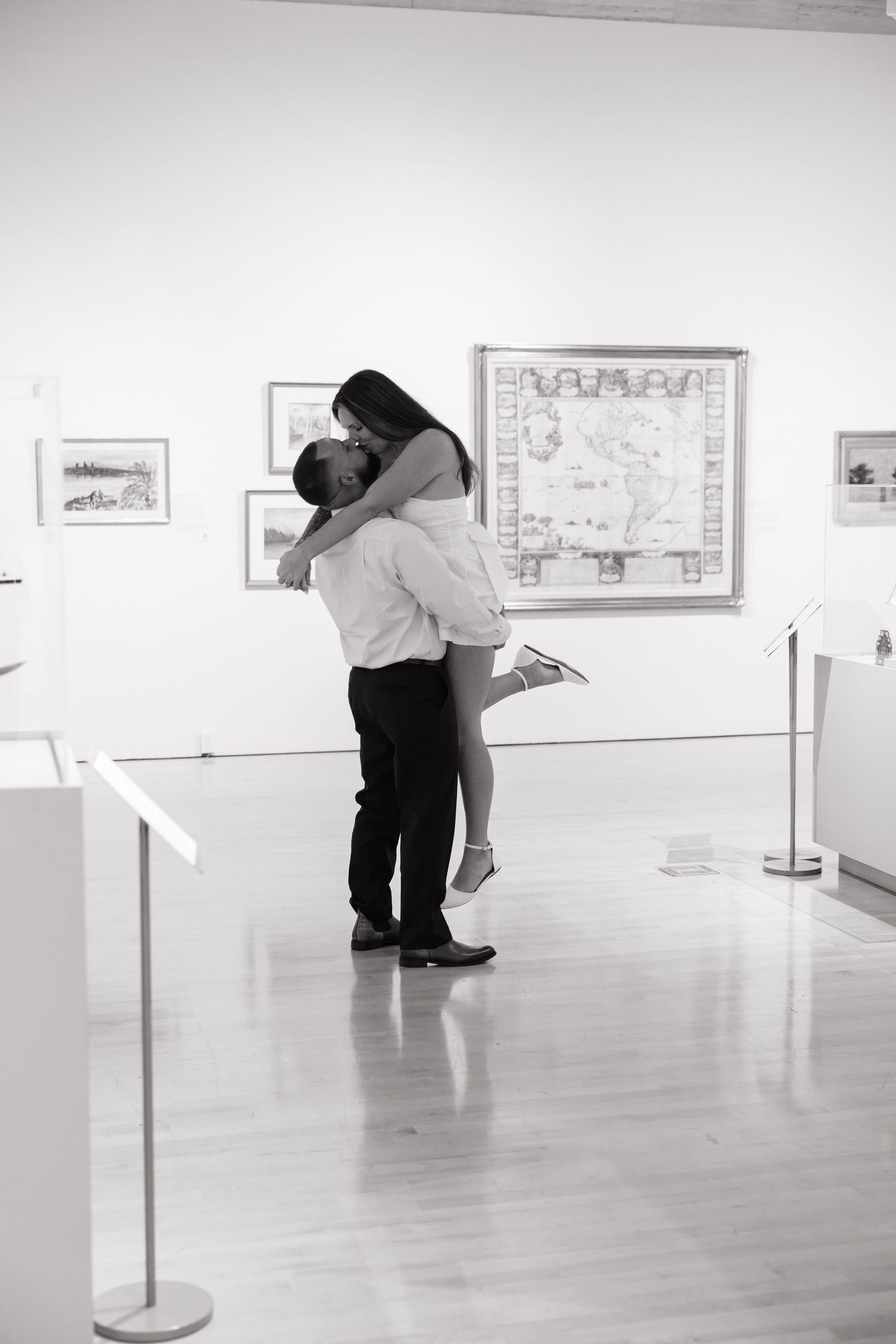 Black and white couple portrait inside an art gallery during a Tampa Bay engagement session.