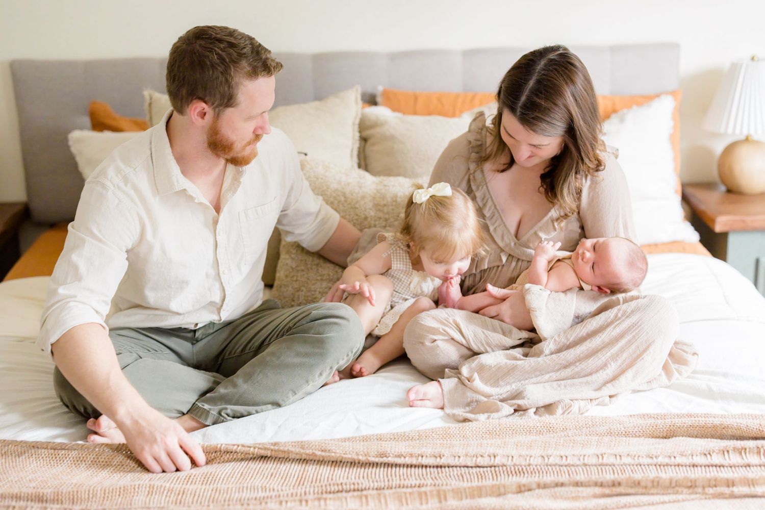Lifestyle newborn photography session with family of four at home in Tampa Bay, Florida.