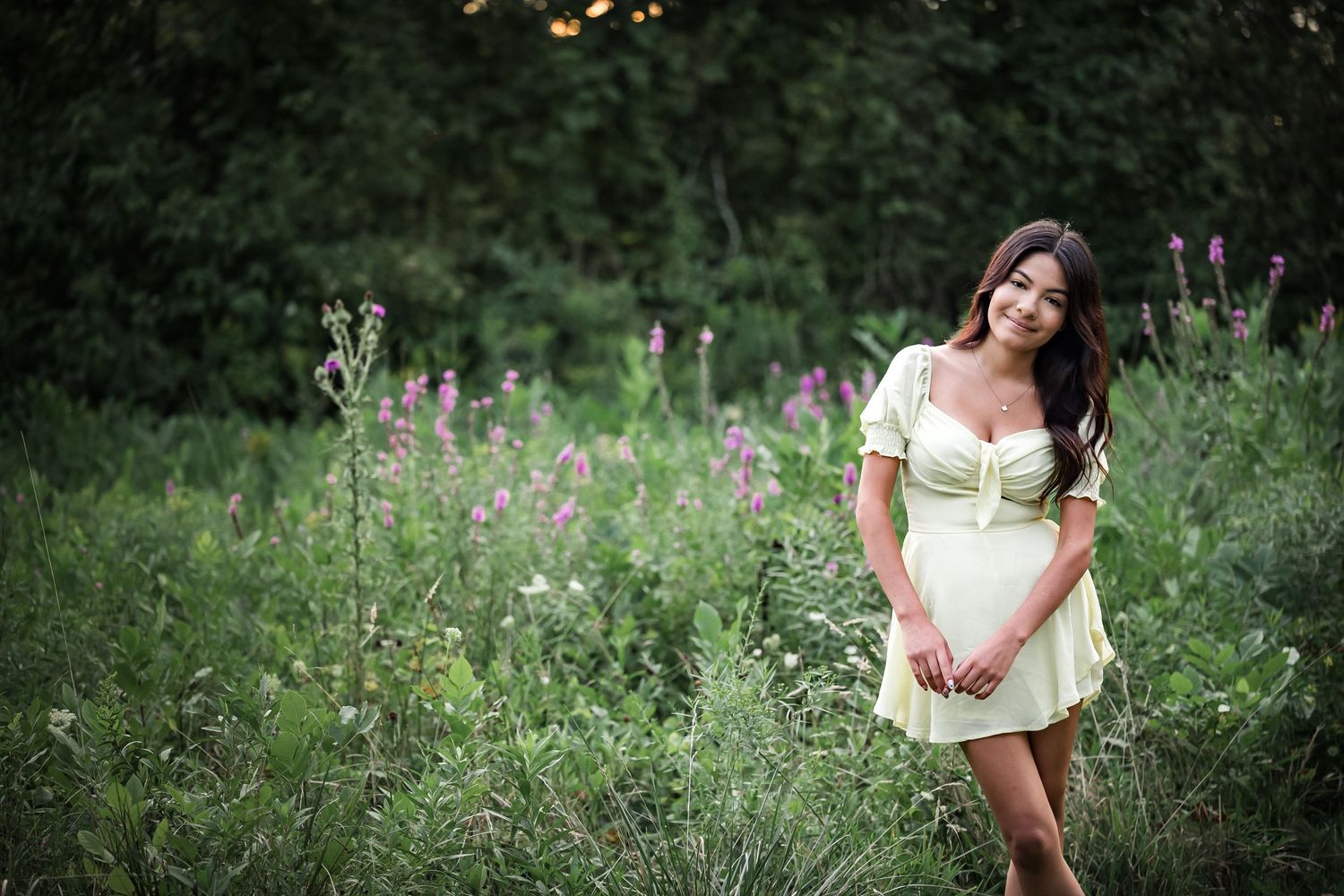 Soft yellow dress photographed in a wildflower meadow at dusk.